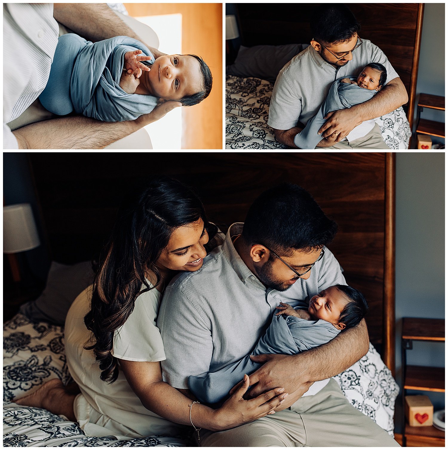 dad holding his newborn baby boy who is swaddled in a blue blanket and he is ooking at him while baby looks up at him and mom is hugging them both