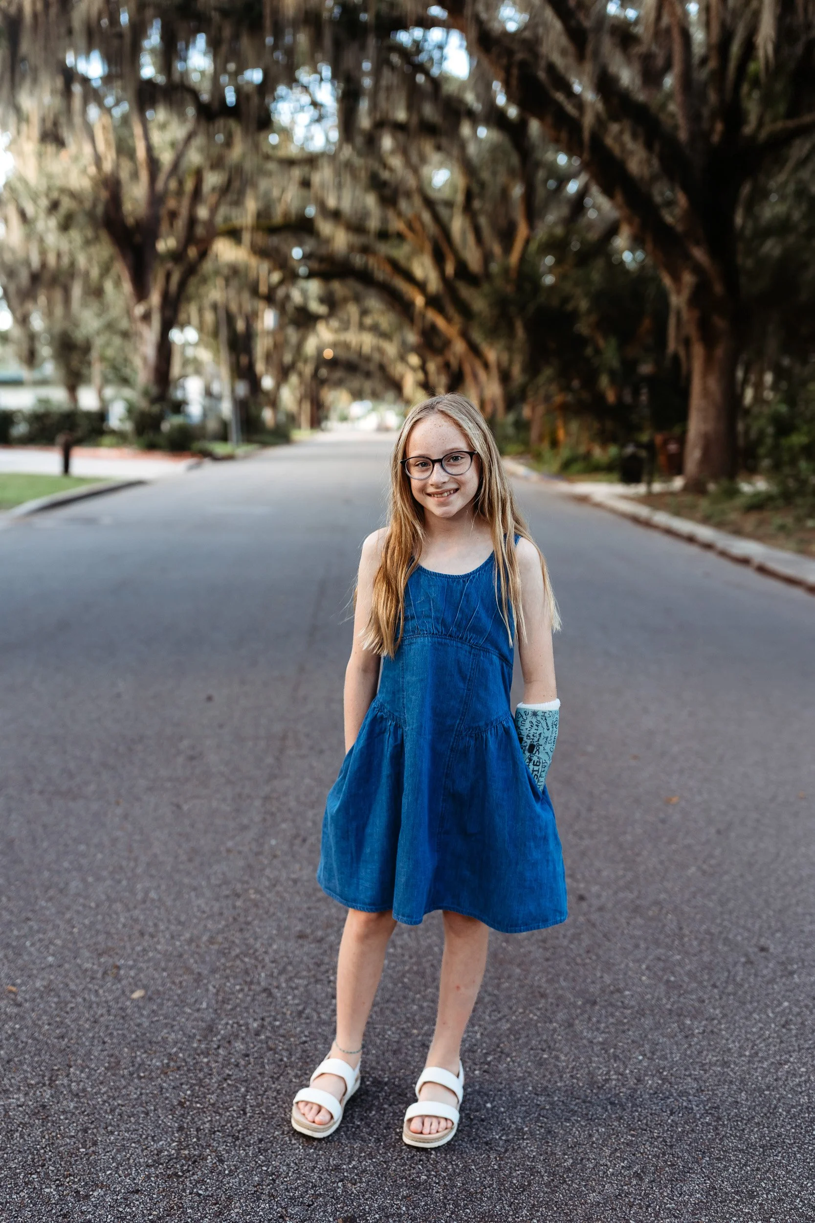 girl in denim dress on magnolia ave for a portrait