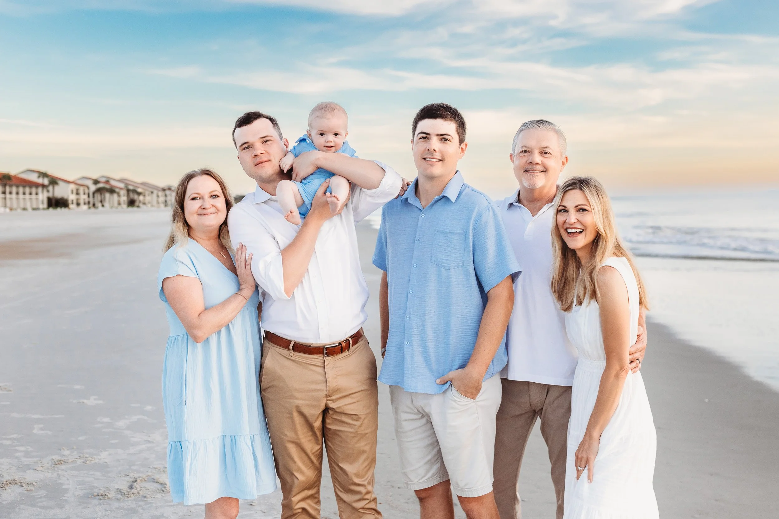 family portrait with three generations at sunrise on the beach in Ponte Vedra