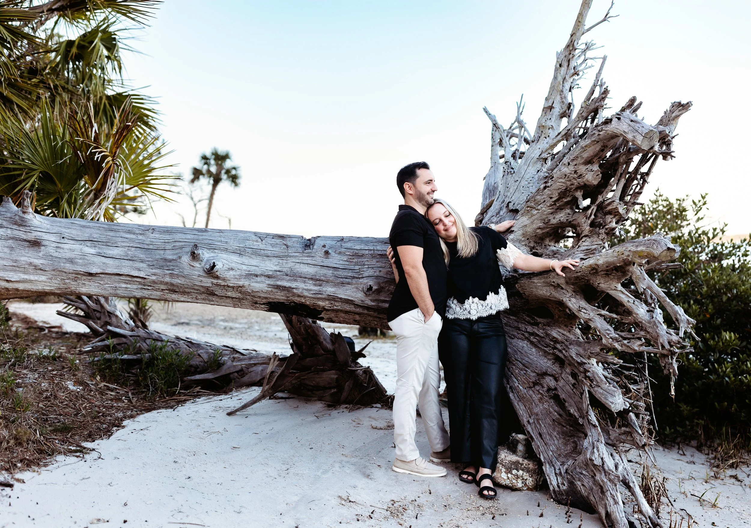 engaged couple embracing by the water in Northeast Florida