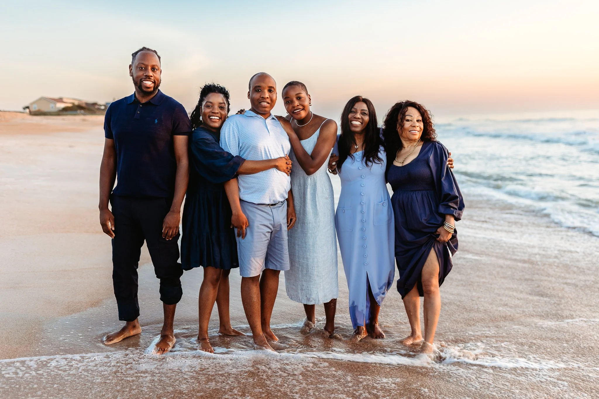 family arriving at the beach just before sunrise for a relaxed photo session in Northeast Florida