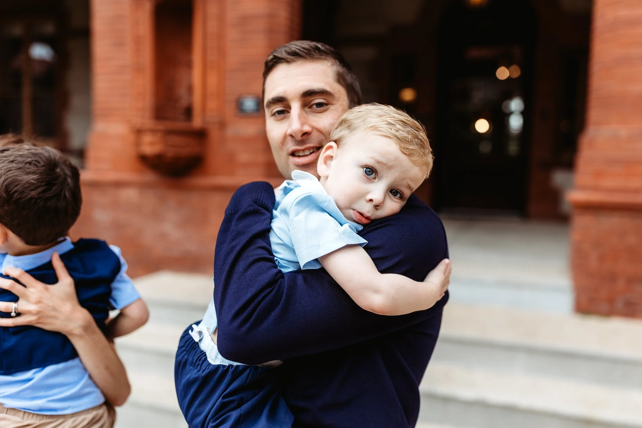 little boy hugging dad