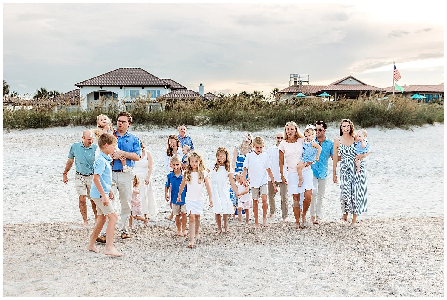 Extended family walking together on the beach in Ponte Vedra