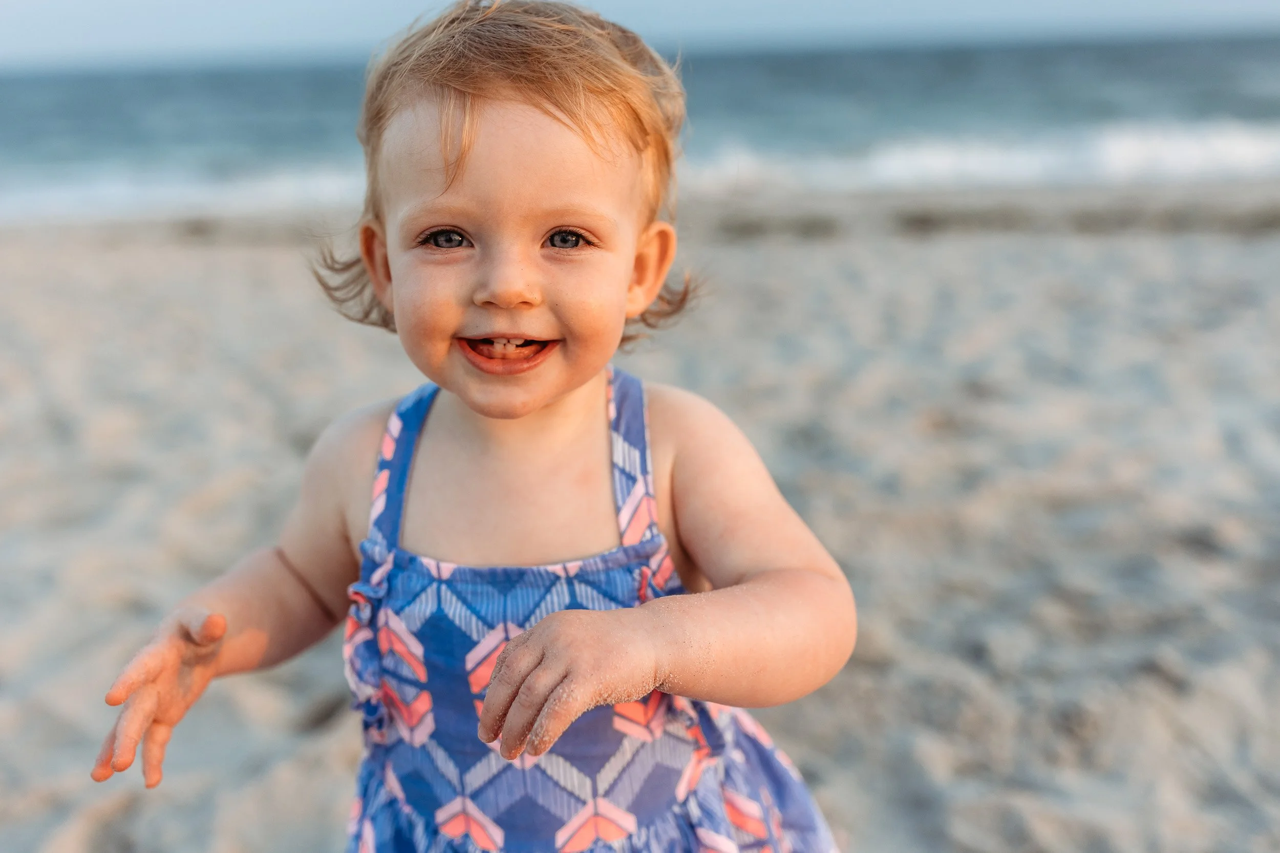 portrait of a toddler laughing on the beach at sunset in Ponte Vedra