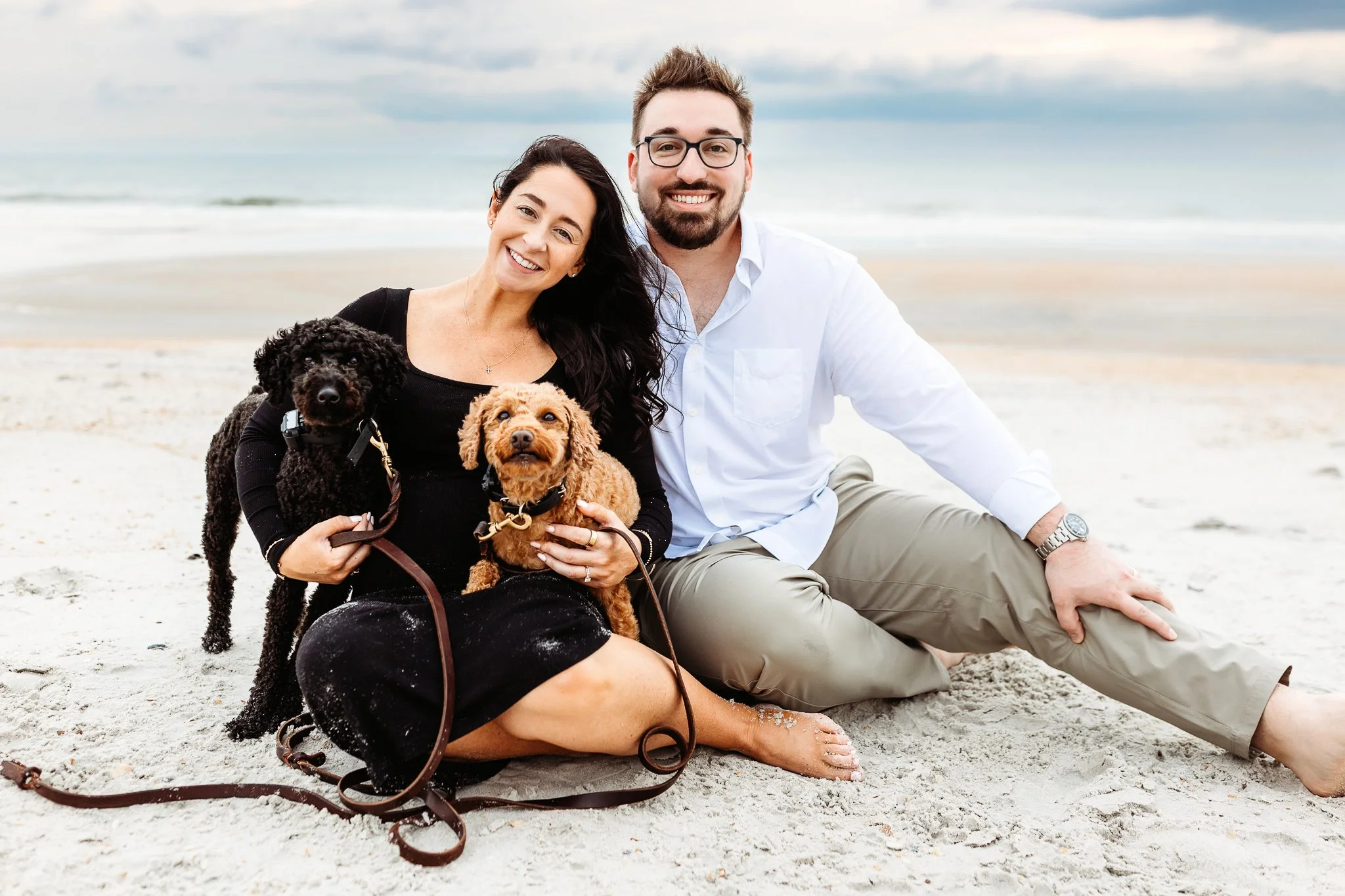Pregnant mother with her dogs on the beach in Ponte Vedra.