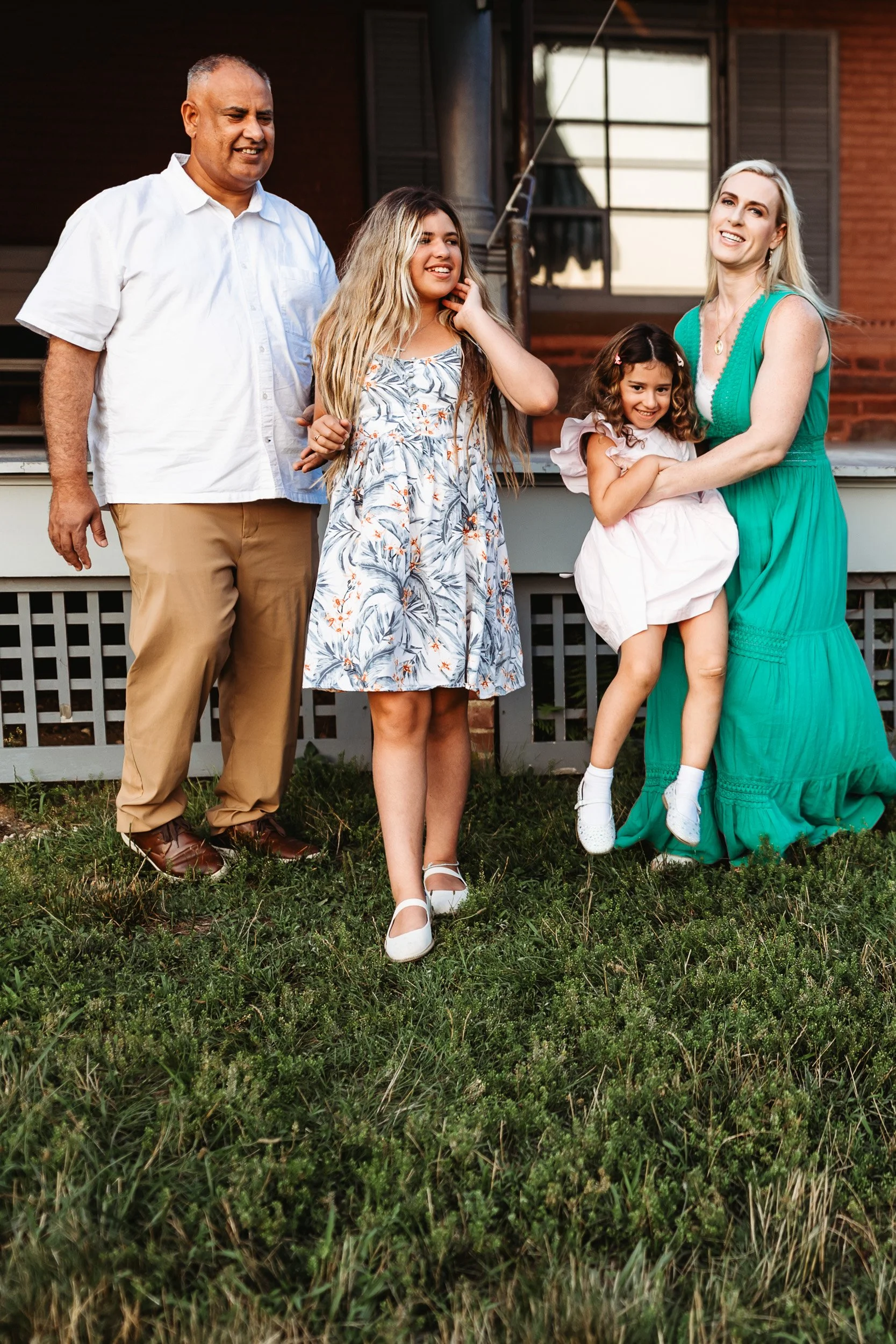 family laughing and playing with children