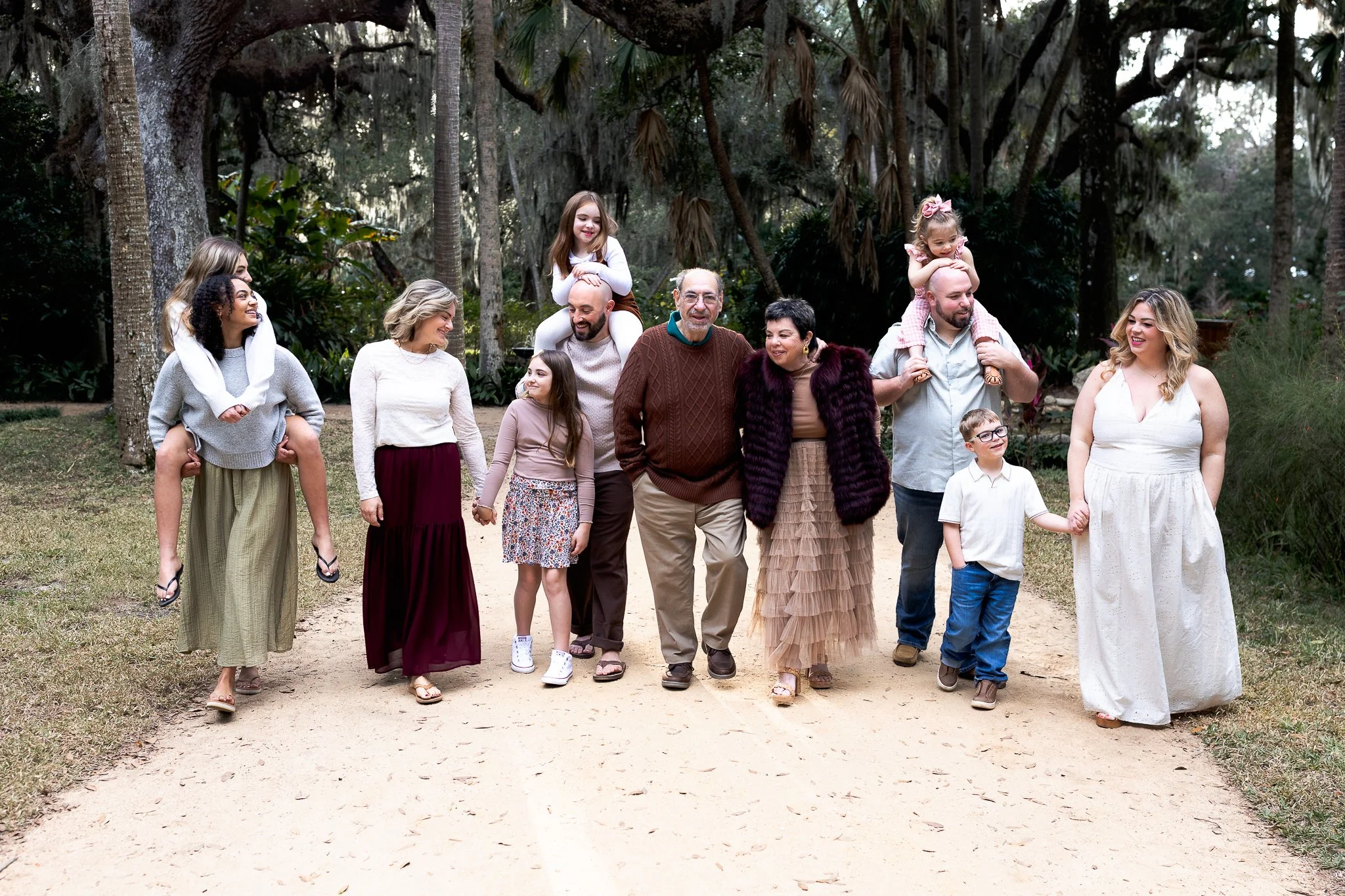 family walking along a path at Washington oaks garden
