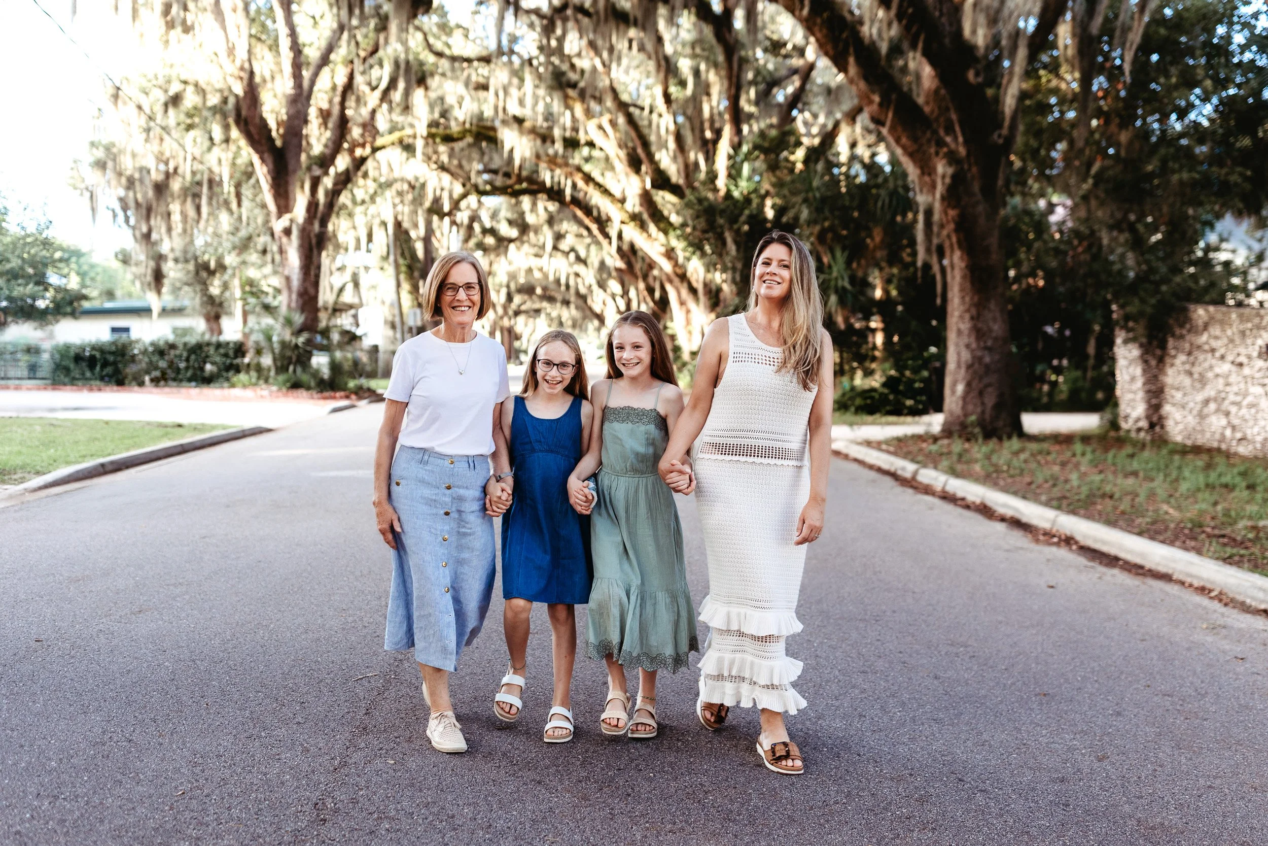 family walking down magnolia ave for family photos