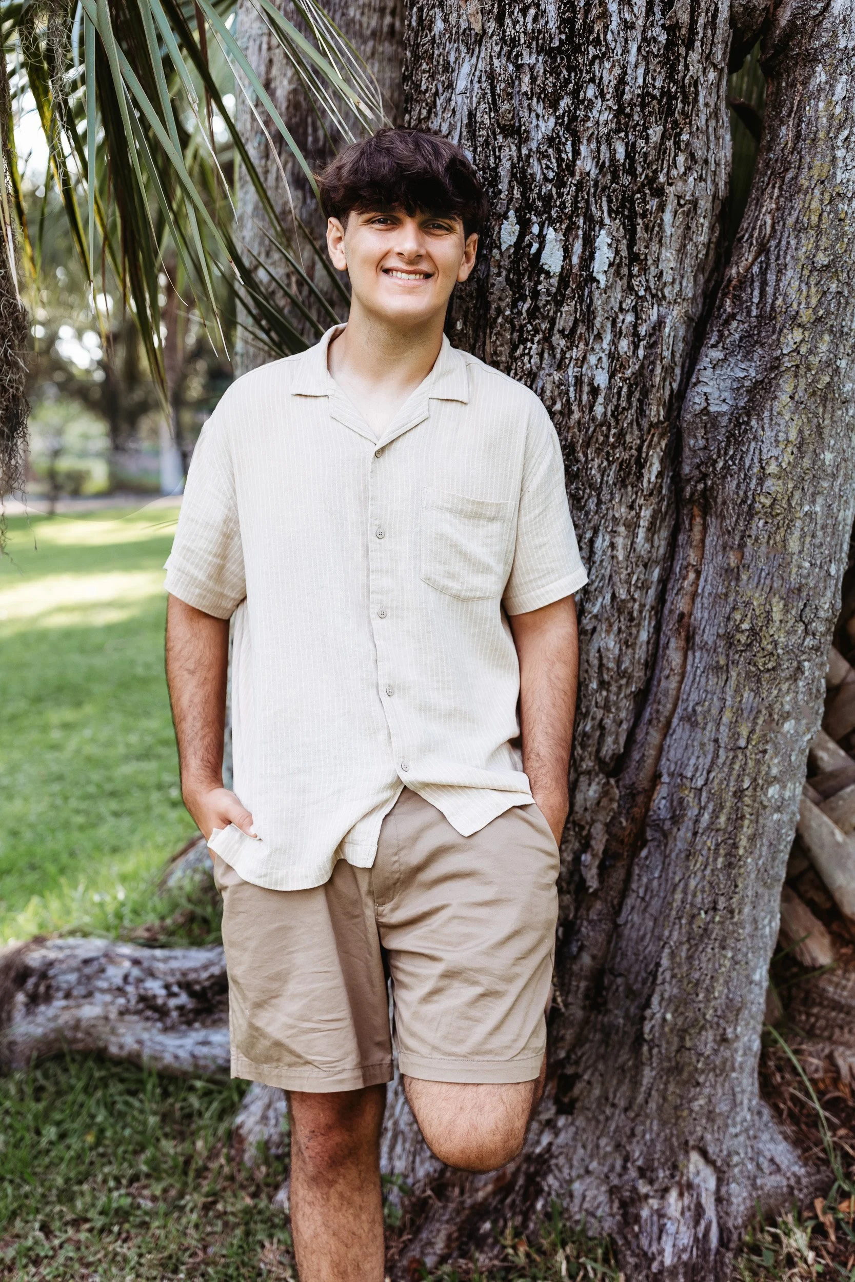 portrait of boy against a tree before he leaves for college