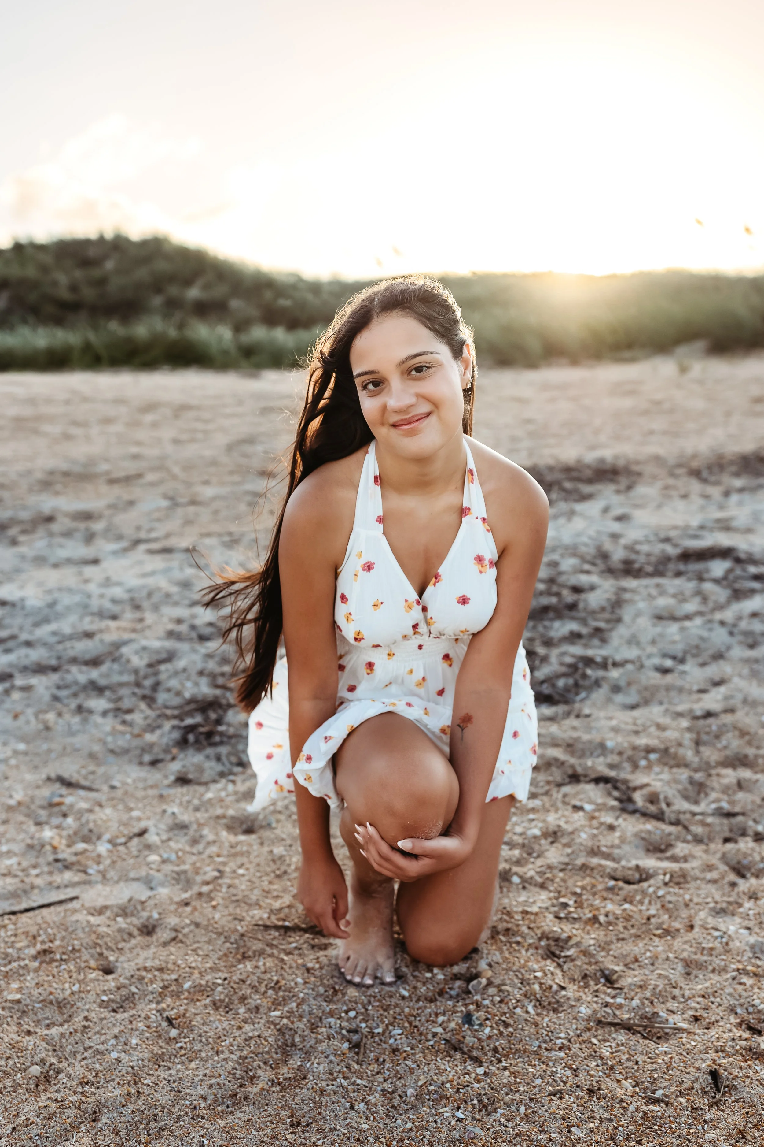 Natural seated portrait in the dunes during a beach session near Nocatee