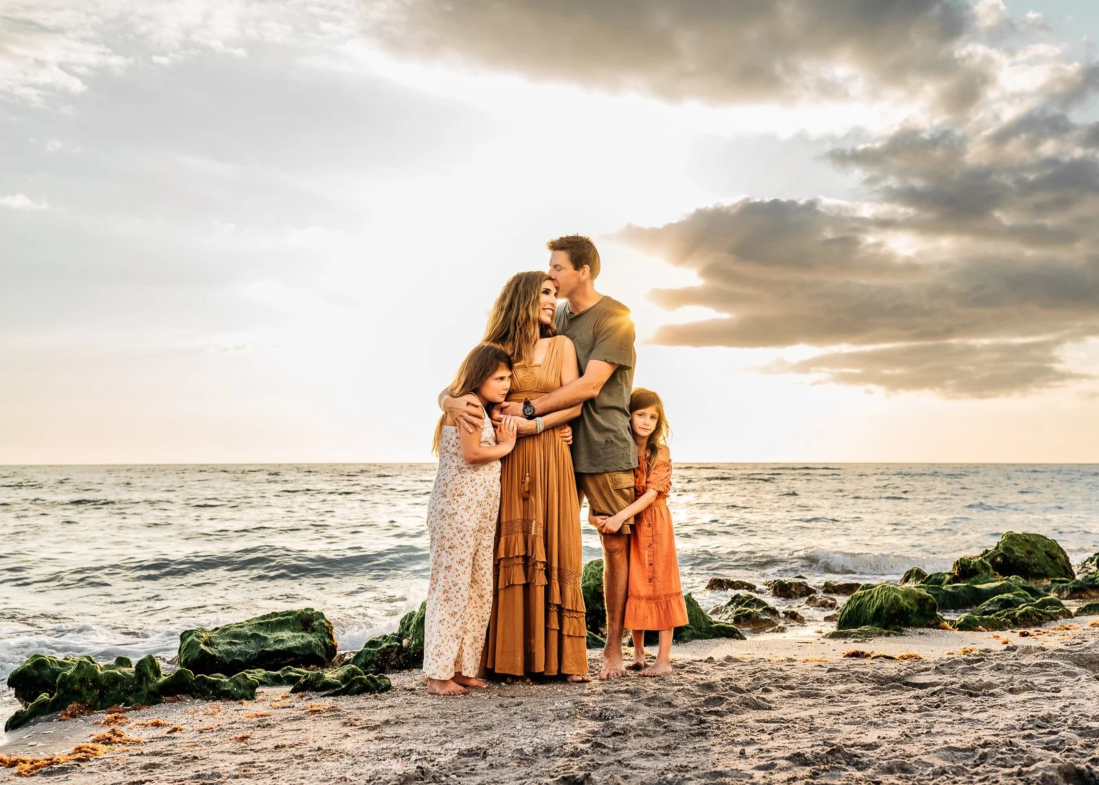 image of Teresa Geraghty with her family on a beach in st augustine