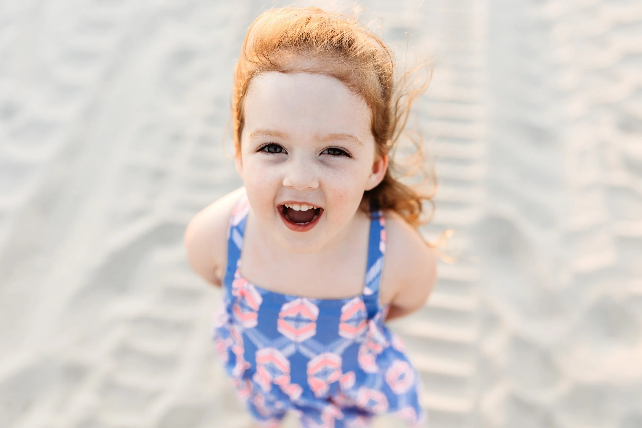 portrait of toddler laughing on the beach in Jax beach