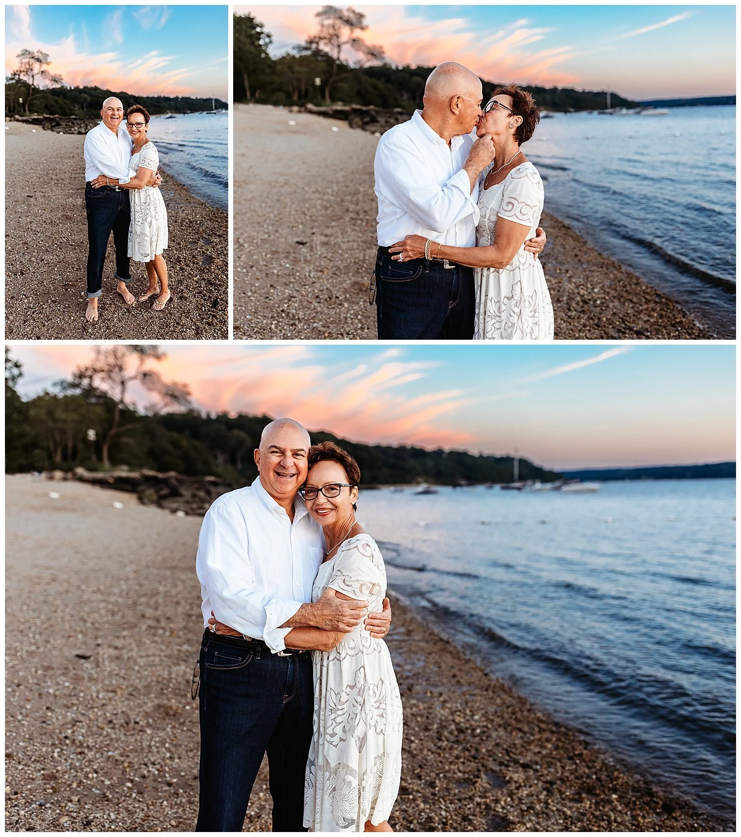 grandparents dressed in white and blue kissing on the beach at sunset