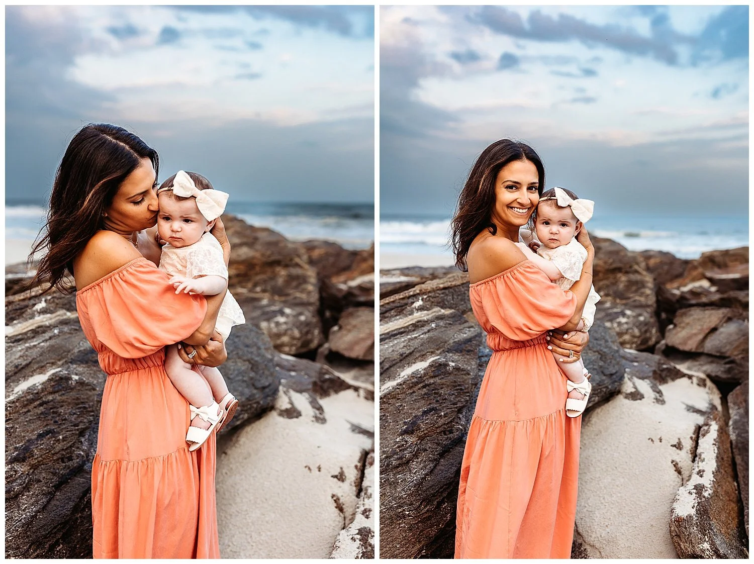 mother in pretty boho floral dress holding a baby with a big white bow on a cloudy evening at the beach