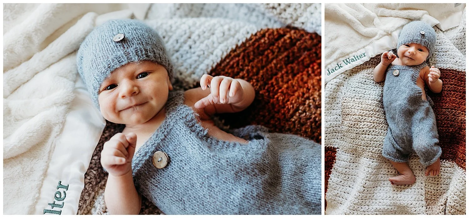 baby boy in grey knit romper and hat laying on a rust and grey handmade afghan blanket
