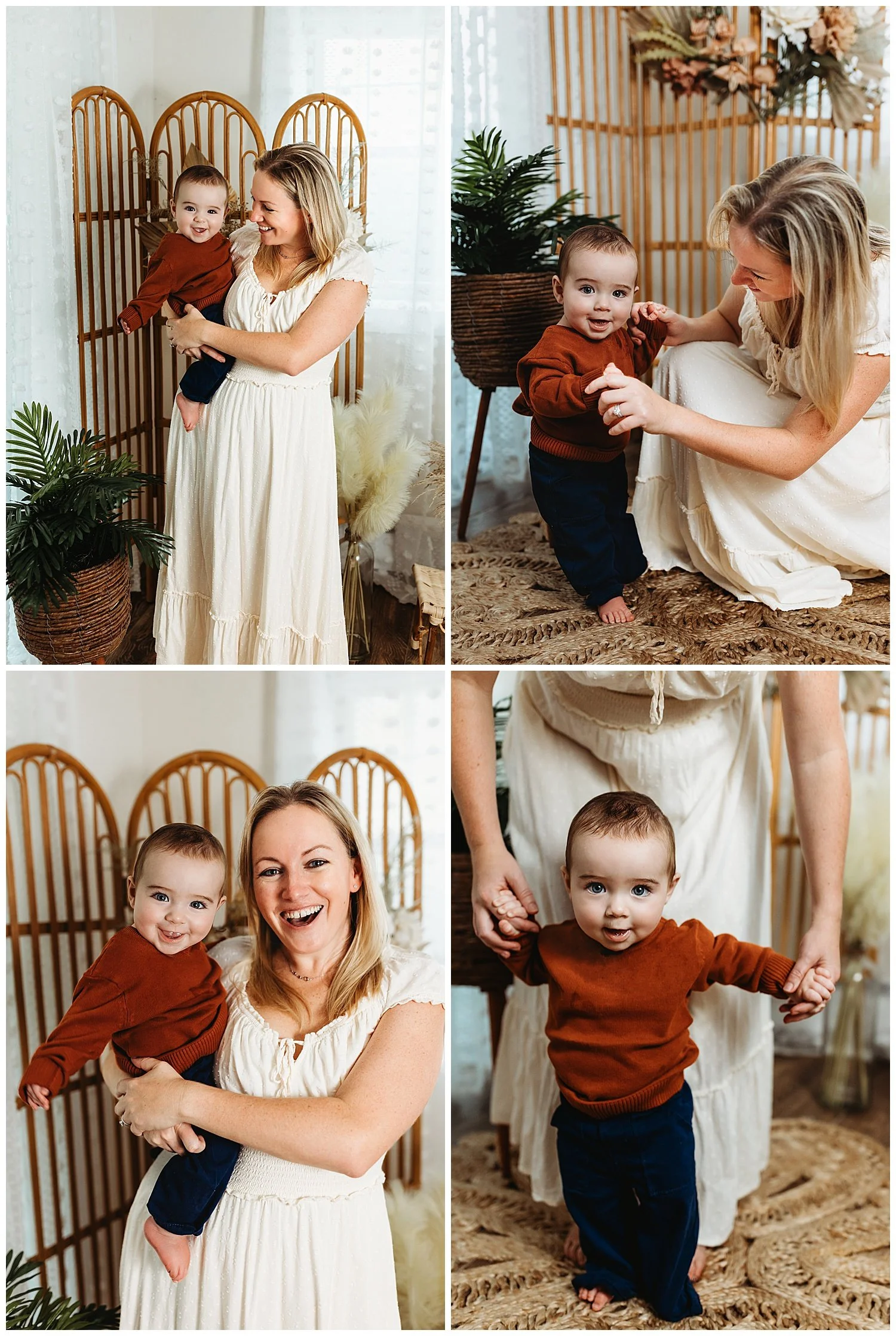 mother in ivory dress kneeling on floor with baby boy in rust sweater who is laughing they are in front of a boho rattan room divider with pampas grass around them