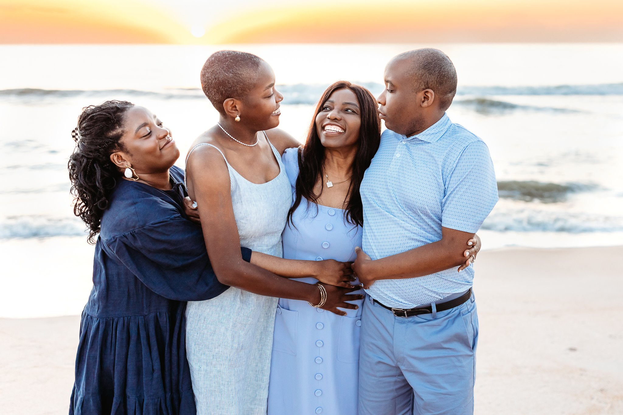 mother being embraced by her adult children at their vacation rental home in Ponte Vedra Beach during their family photos