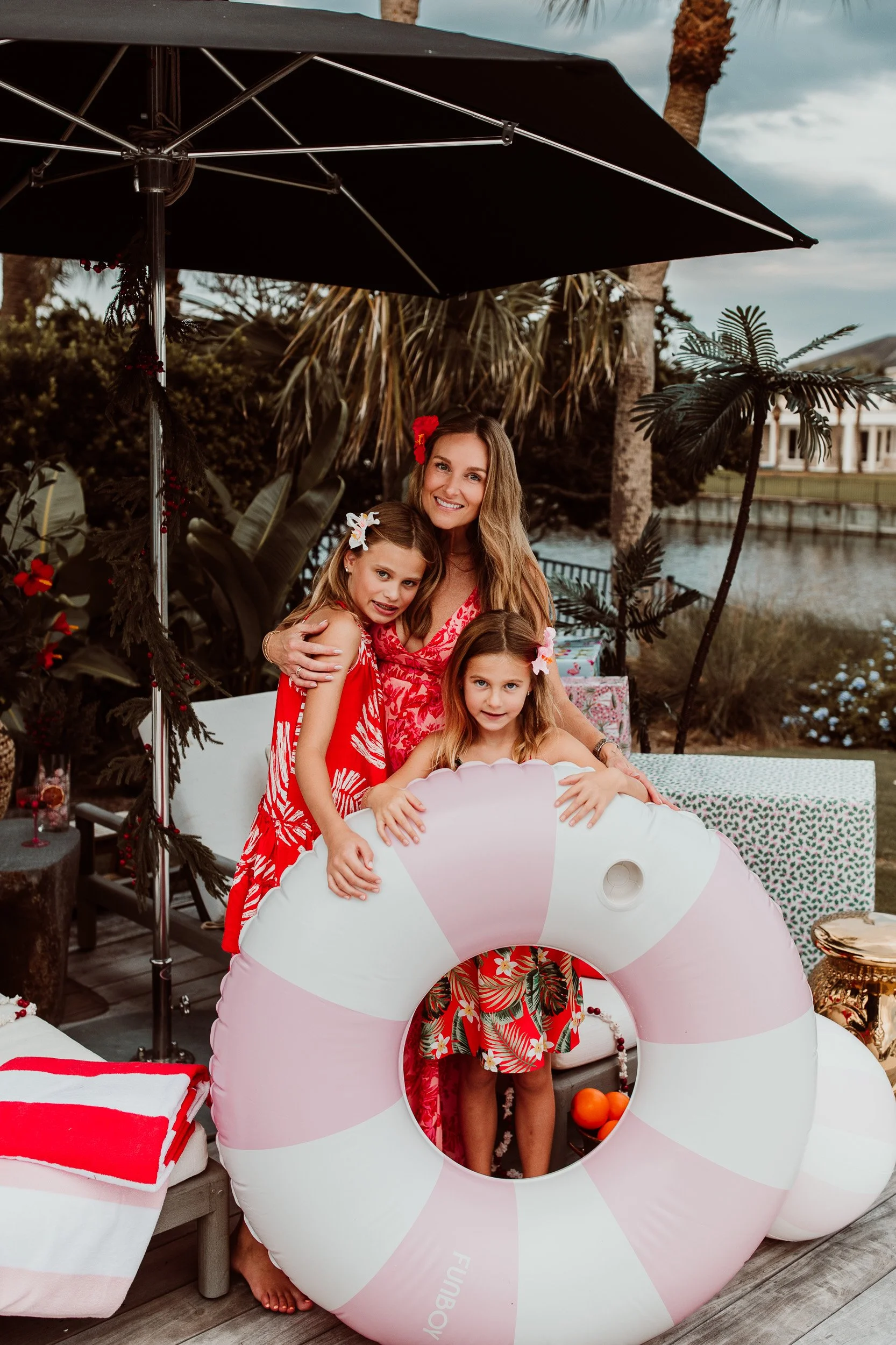 Mother sitting with her children during a backyard family session