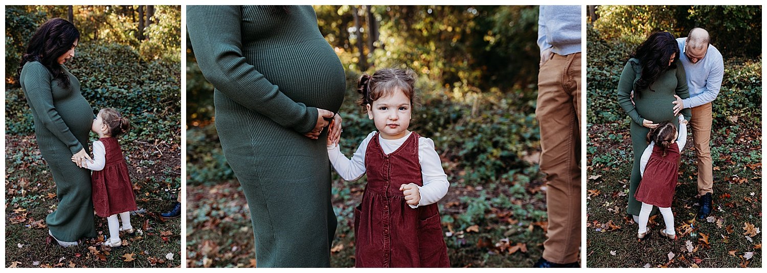 toddler girl kissing mom's pregnant belly