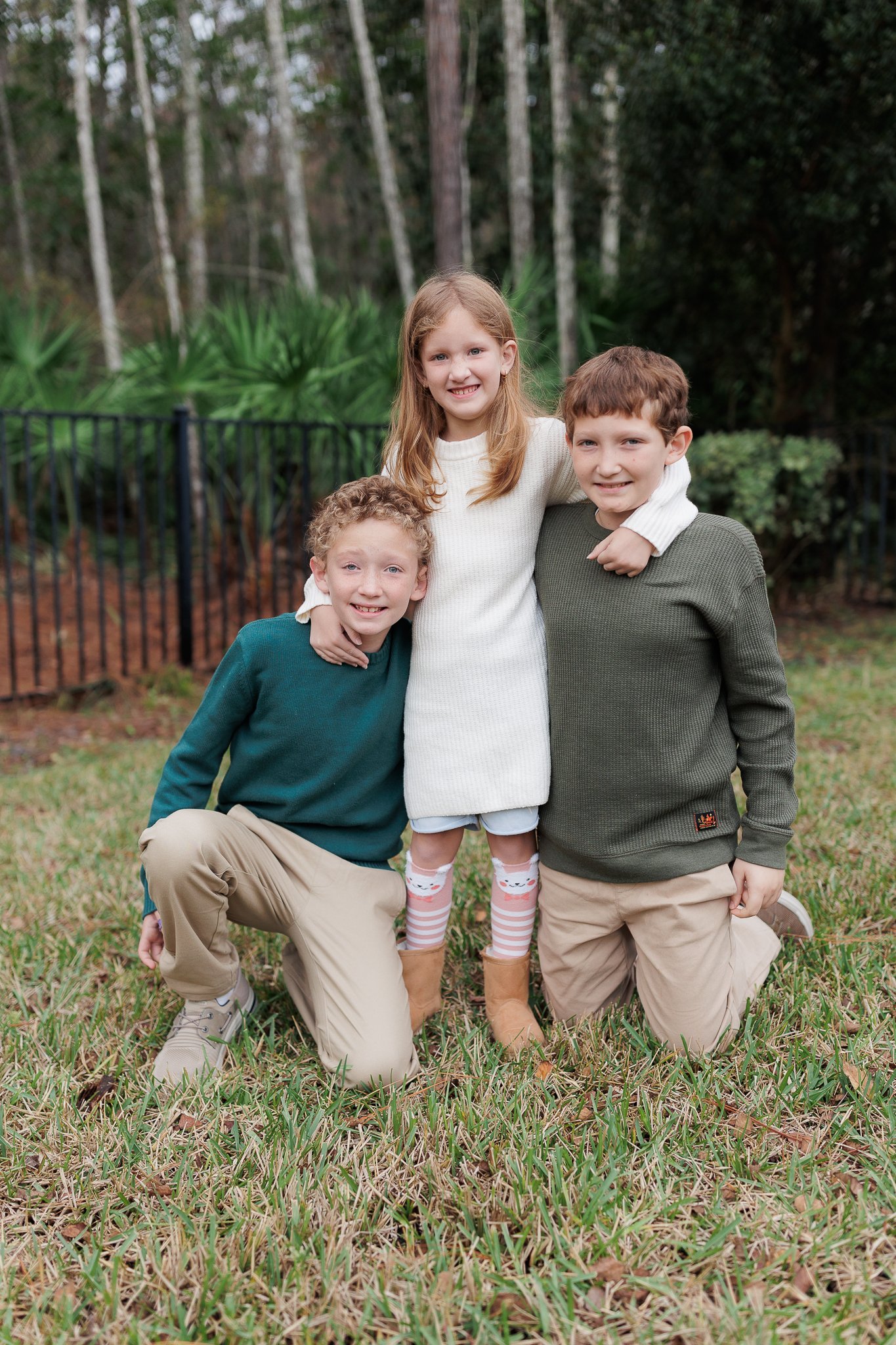 siblings in a yard for a portrait