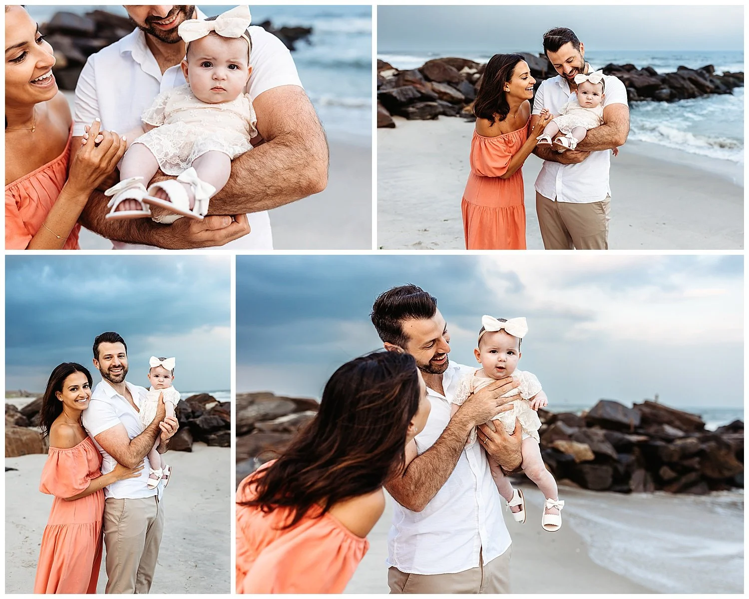 family holding baby girl with lace dress and big bow and jetty behind them with deep dark clouds in sky