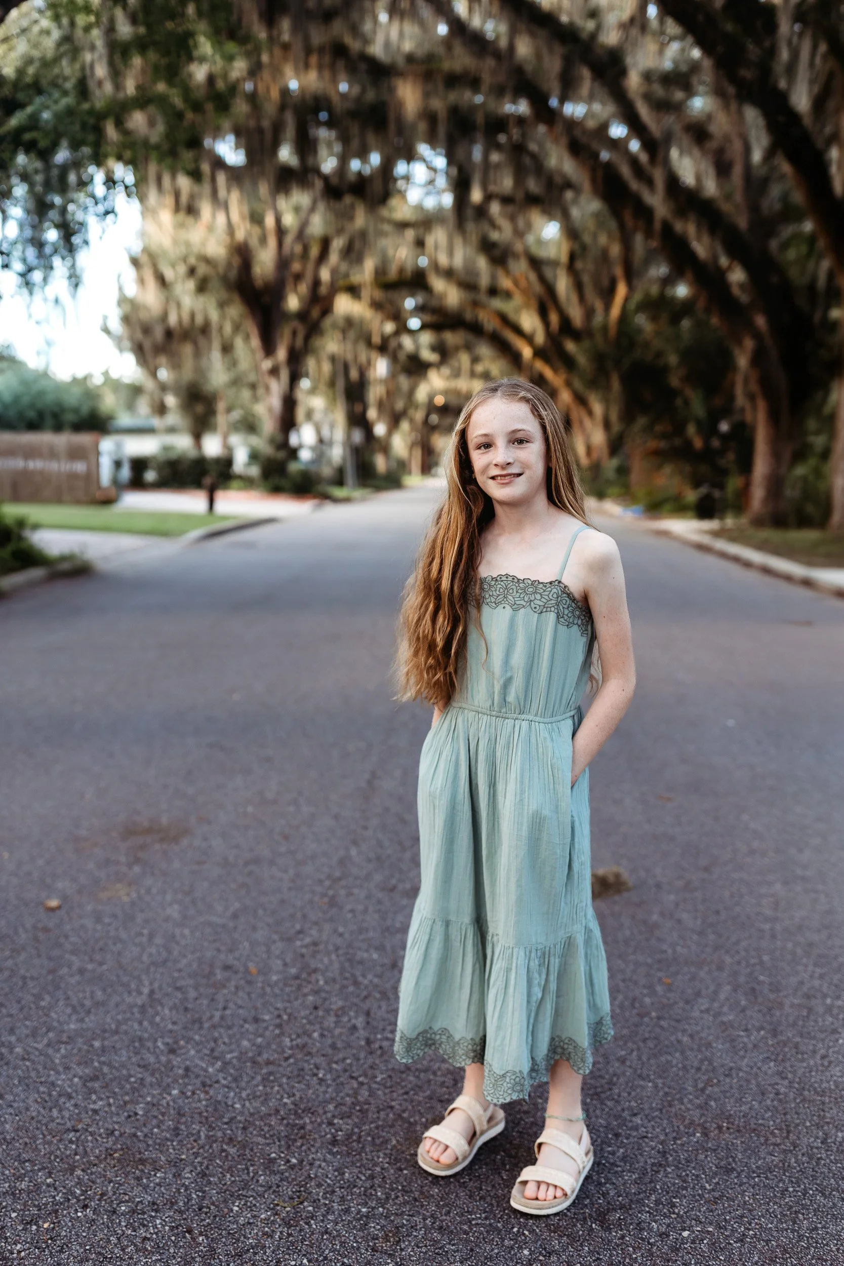 Family photos under the live oak canopy on Magnolia Avenue in St. Augustine, Florida