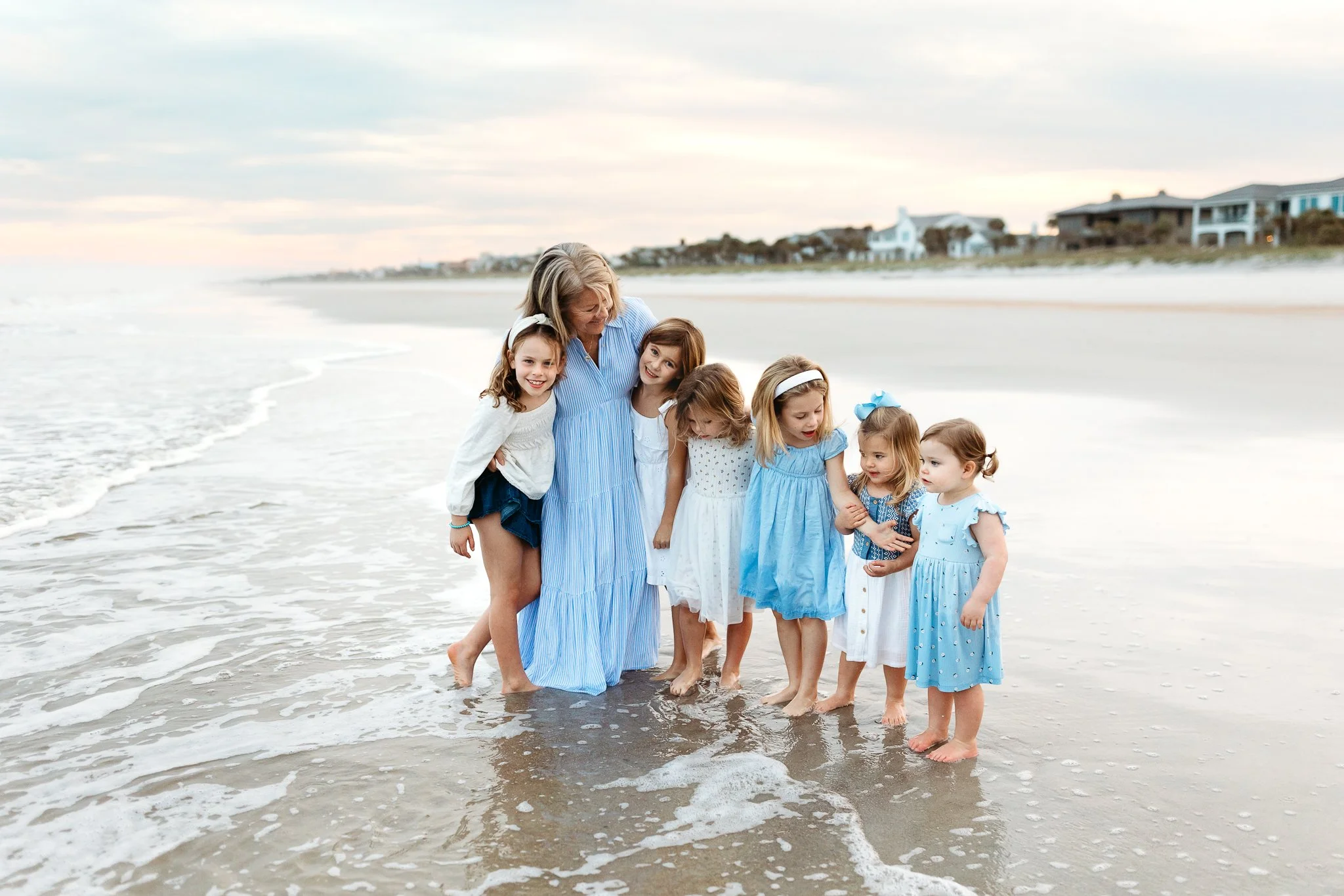 Granddaughters kissing their grandmother during a St. Augustine beach session