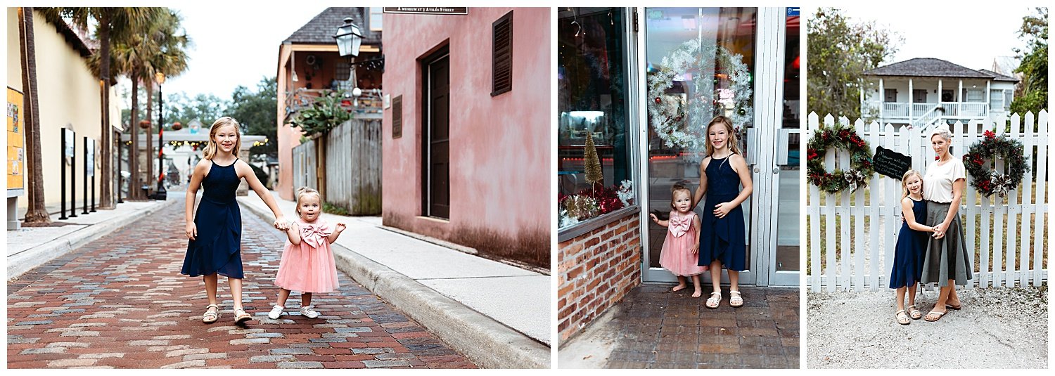 family walking down the cobblestone street in st augustine and there are christmas wreaths and decorations