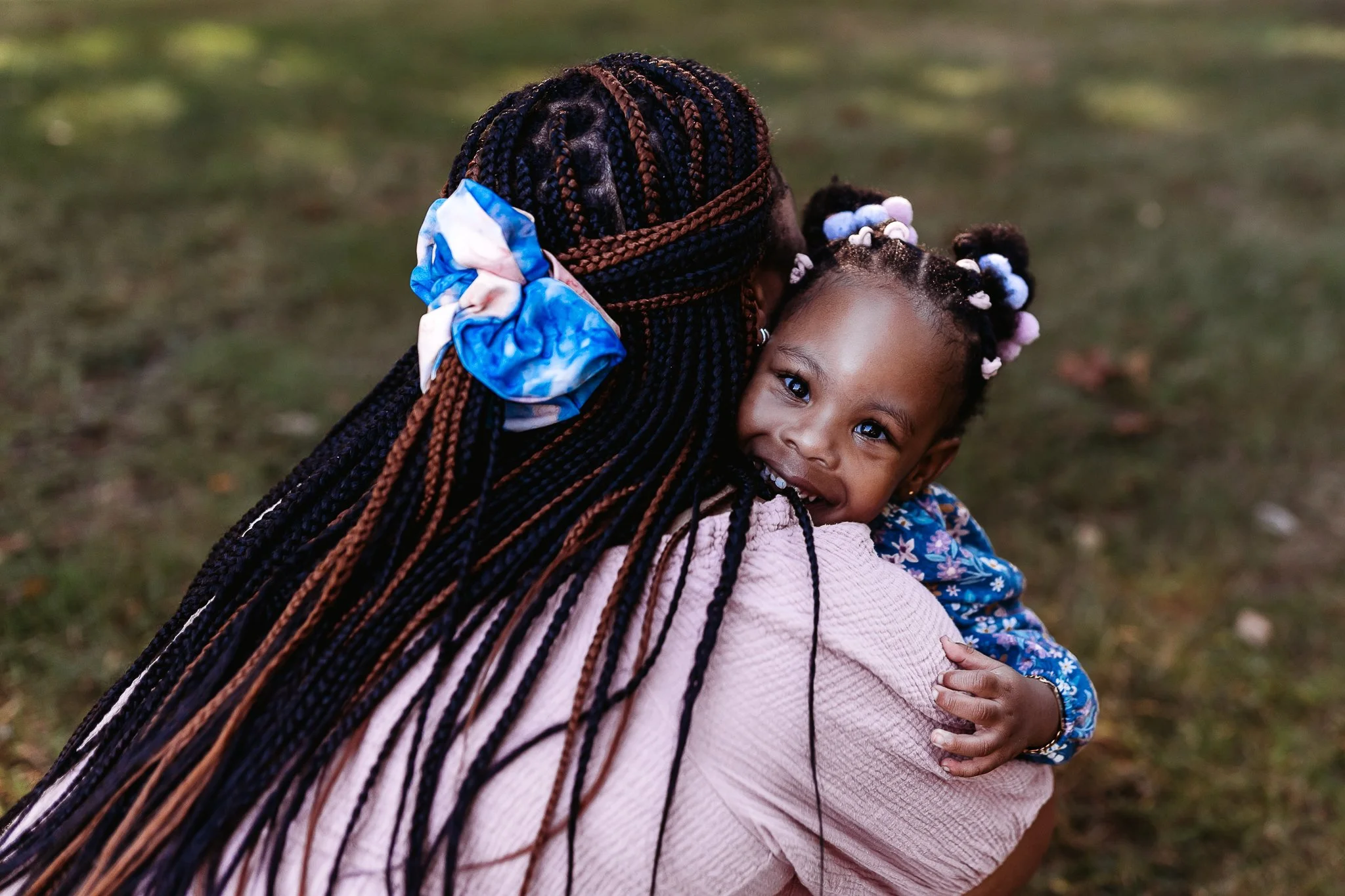 little girl hugging her mom during family photos at a park in st augustine