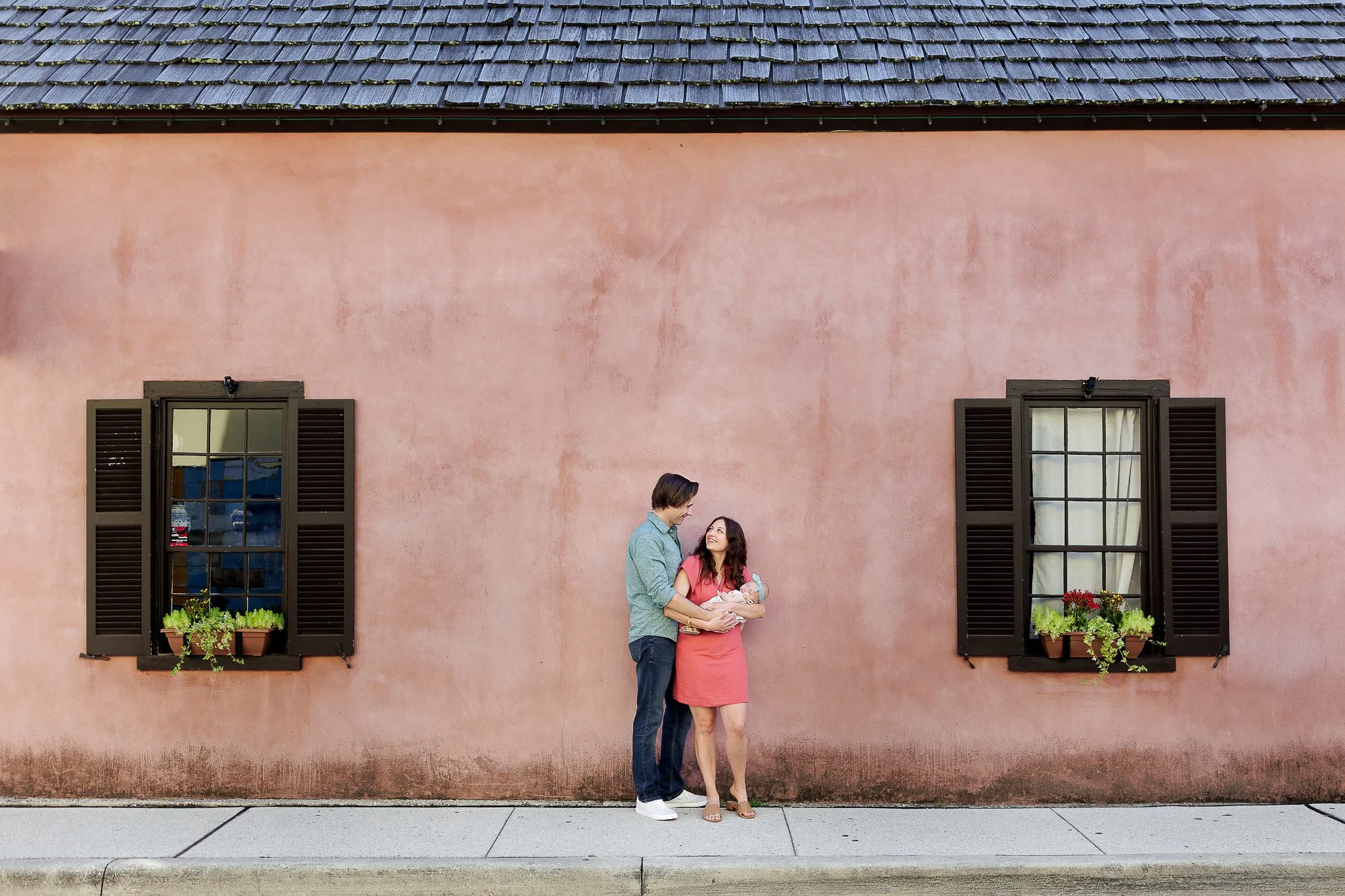 couple in front of pink building in st augustine