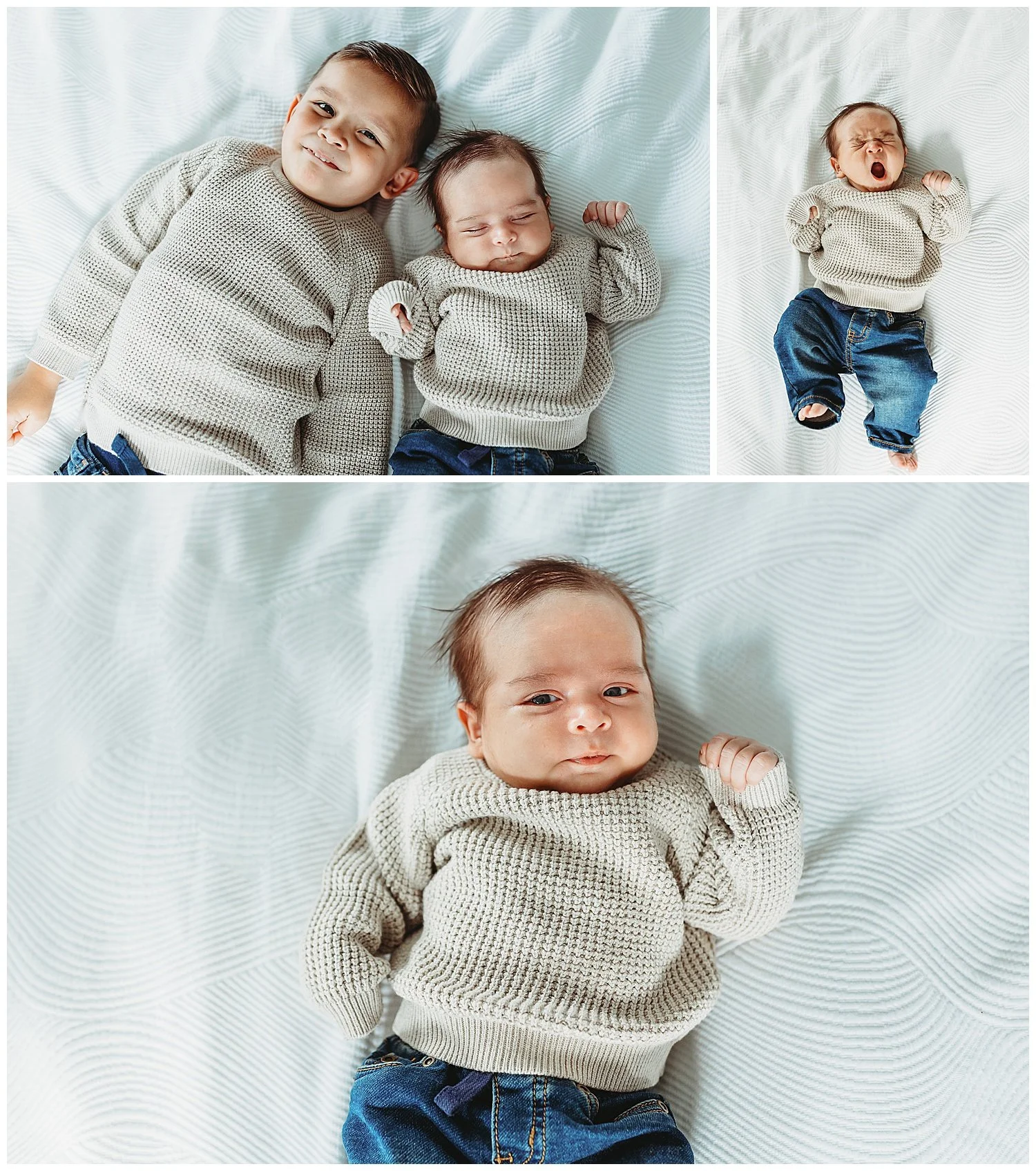 newborn boy in jeans and tan sweater yawning on a bed