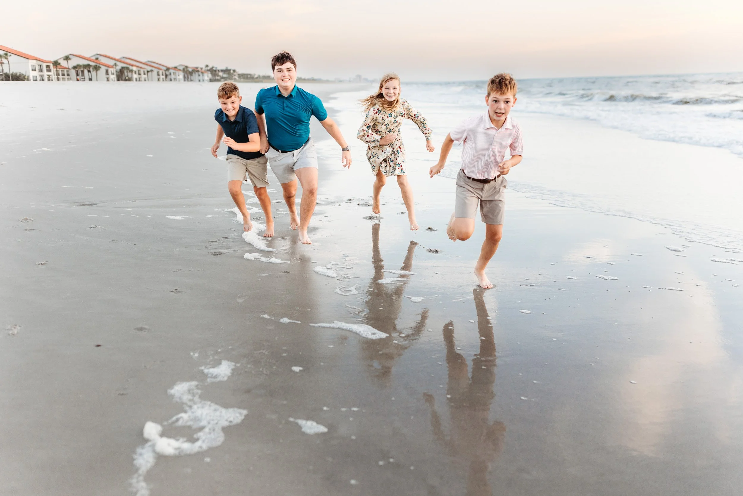 Children playing on the beach during a family photo session in Ponte Vedra Beach