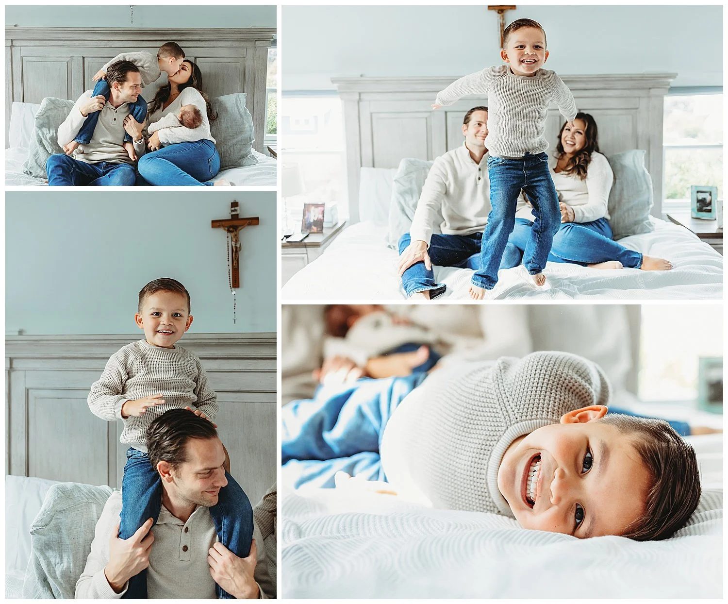 toddler boy jummping on a white bed while parents laugh and hold newborn baby boy