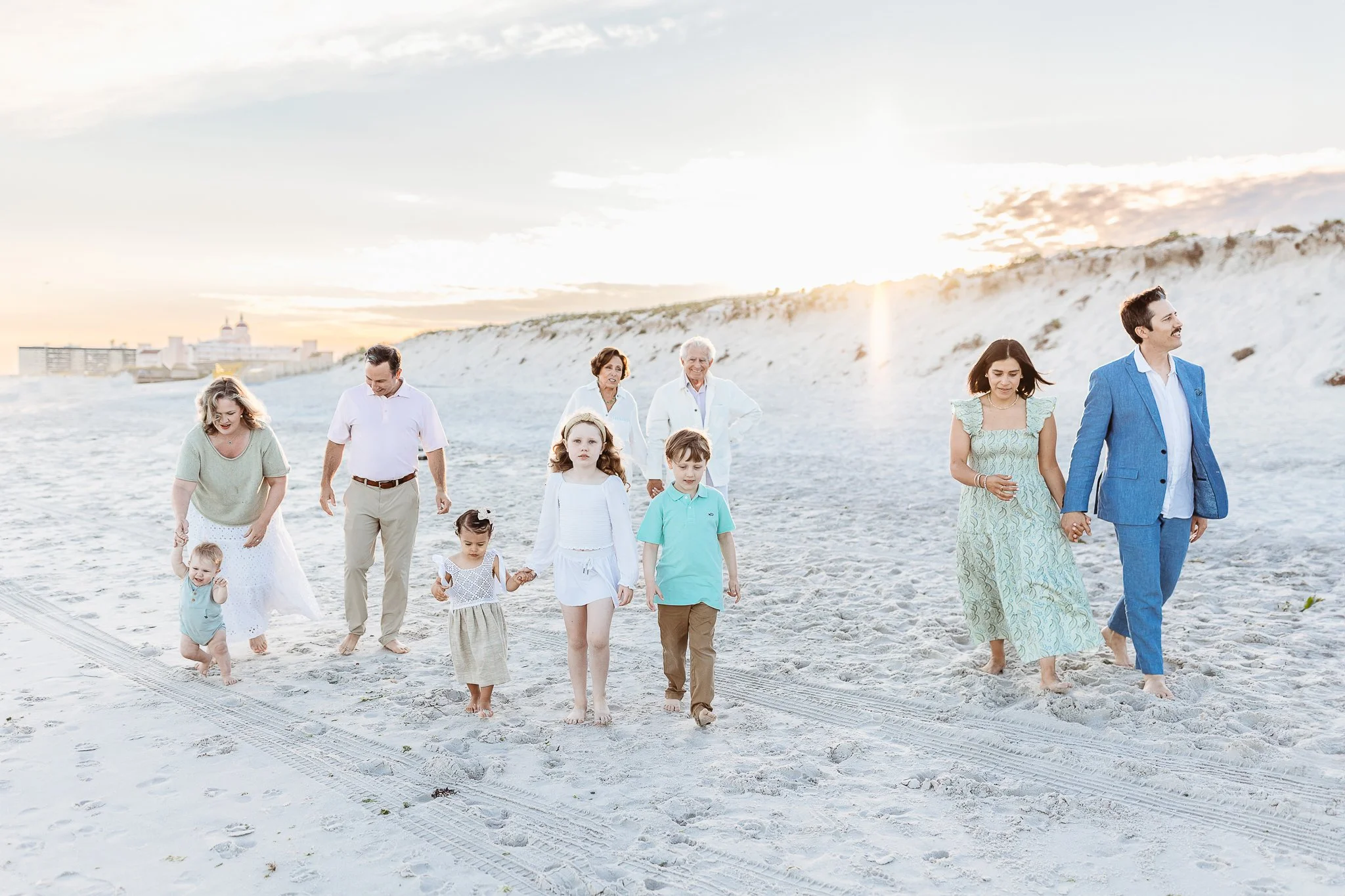 grandchildren walking on the beach at sunset in st augustine for family photos