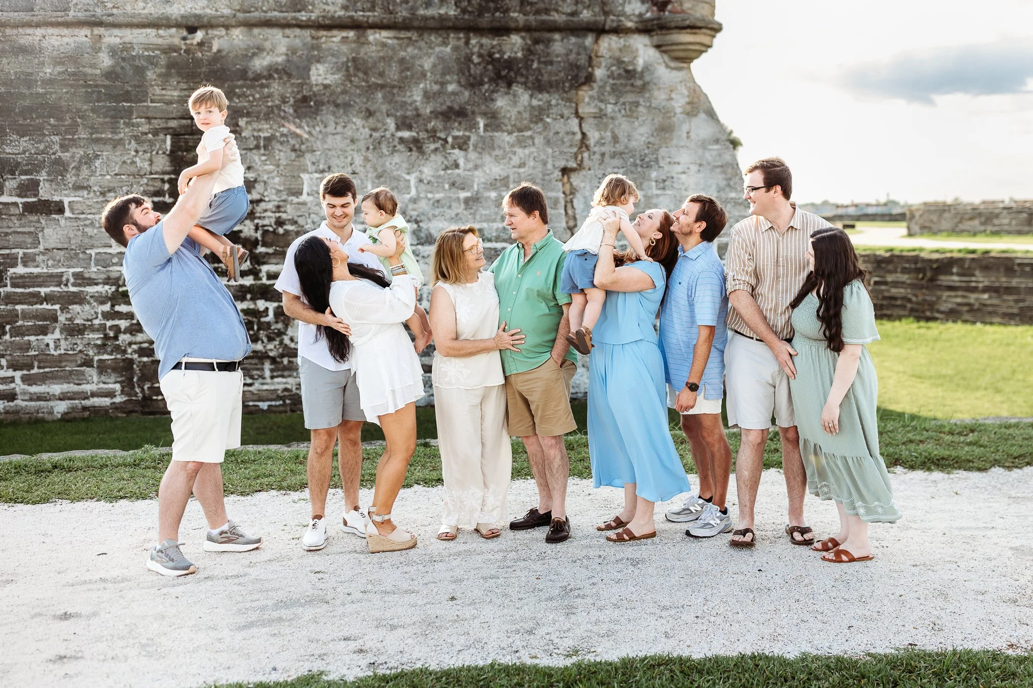 Three generations together during a family reunion photo session.