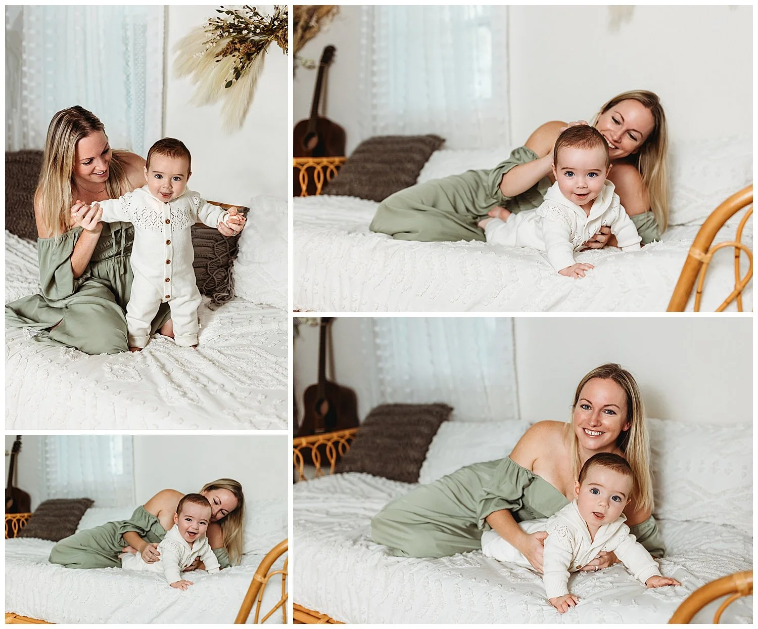 mother laying on bed in sage cottage core dress with her baby boy in ivory jumper who is laughing and crawling