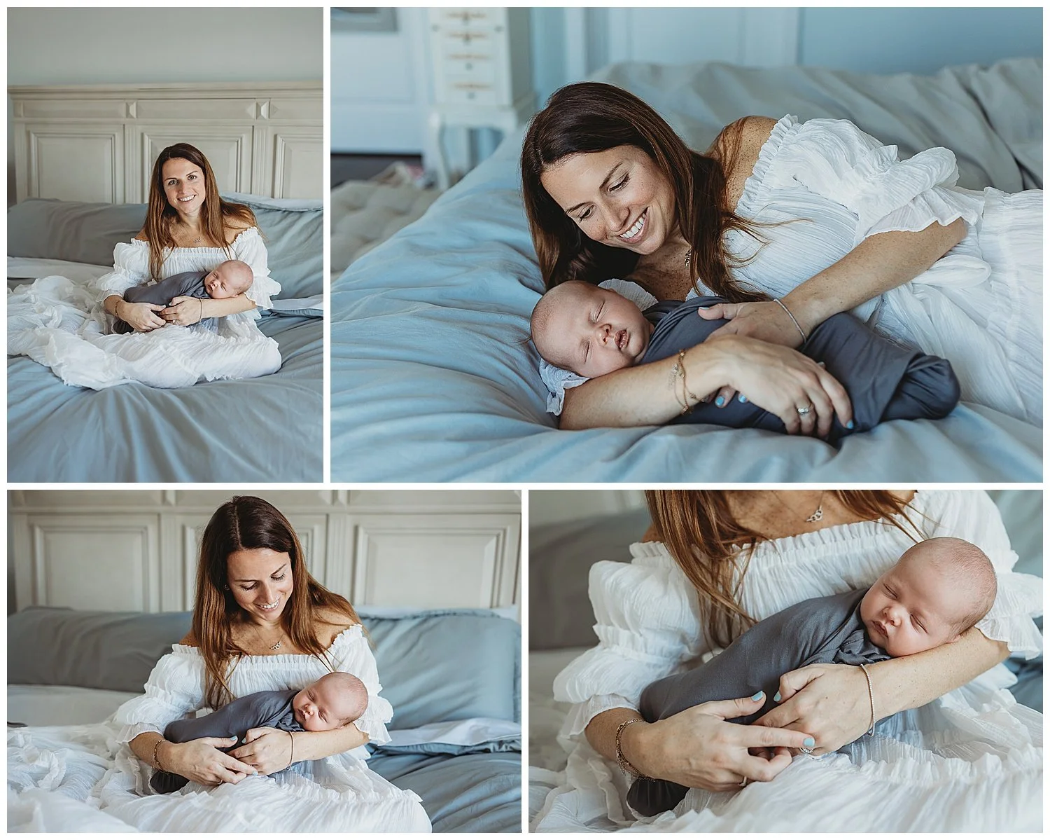 mother laying on a blue bed with baby swaddled in grey jersey knit blanket and she is in a white maxi dress looking at baby smiling