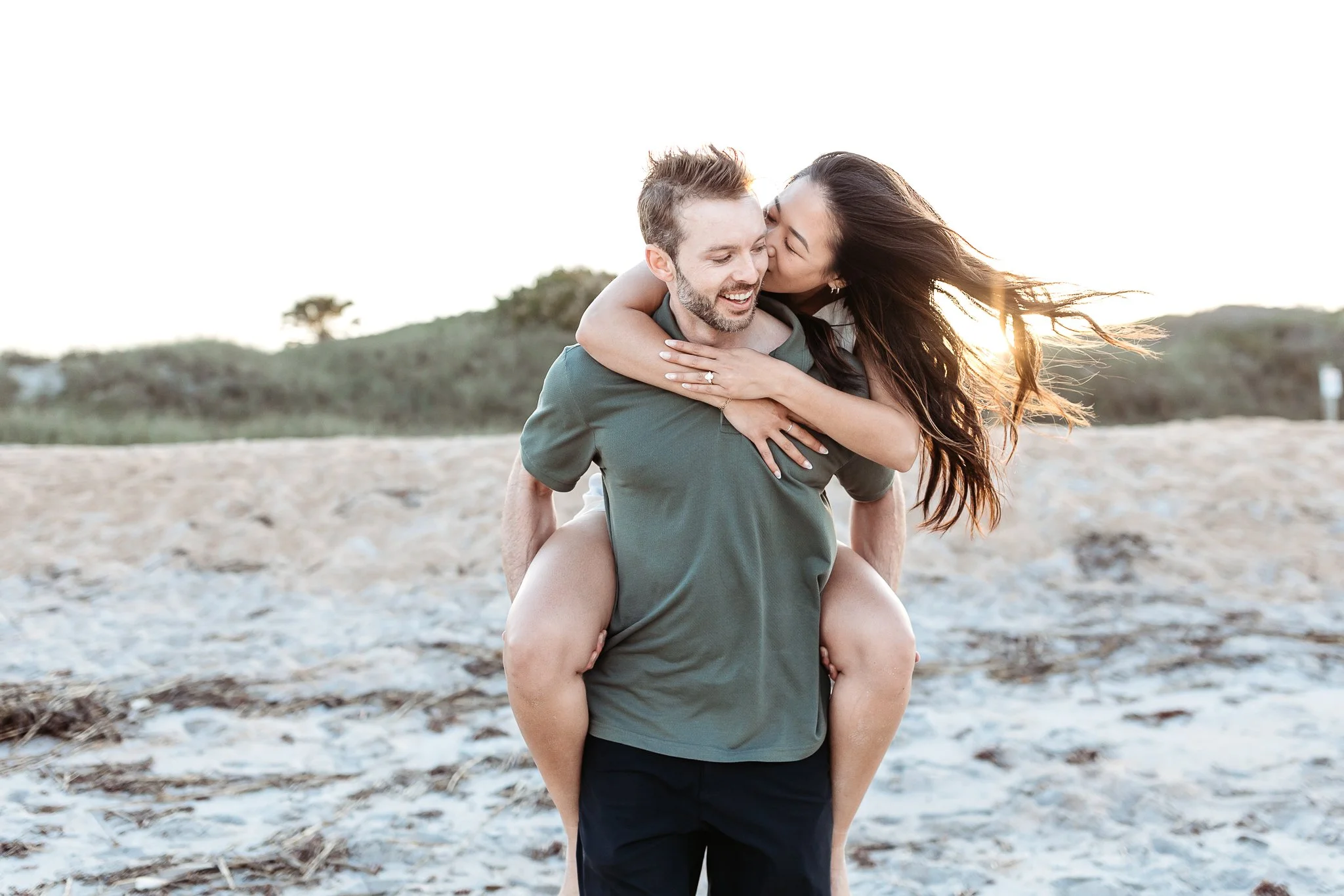 Couple embracing after proposal during engagement photos in St. Augustine