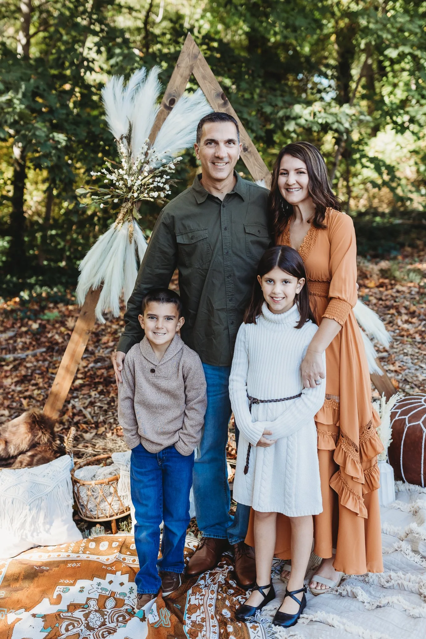 family in neutral boho outfits for family photos in the fall in nocatee