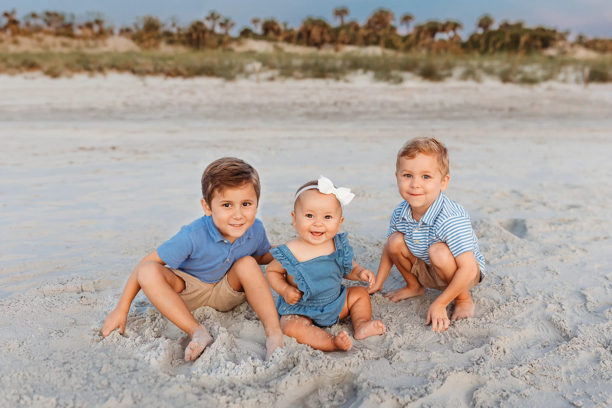 classic portrait of siblings on the beach at sunrise