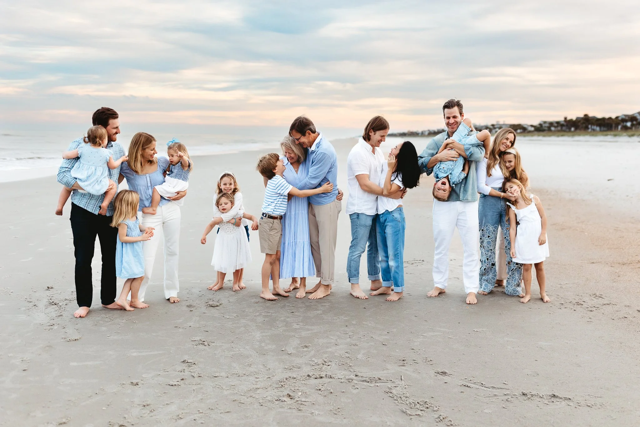 wide scenic image of a candid moment during a multi generational family session