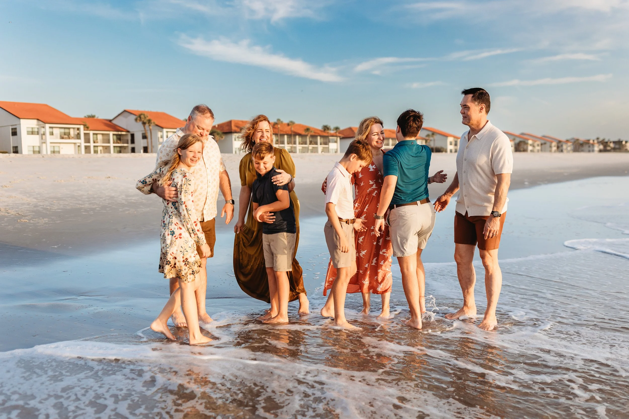 candida family moment during a large extended family session on th beach in Ponte Vedra at sunrise