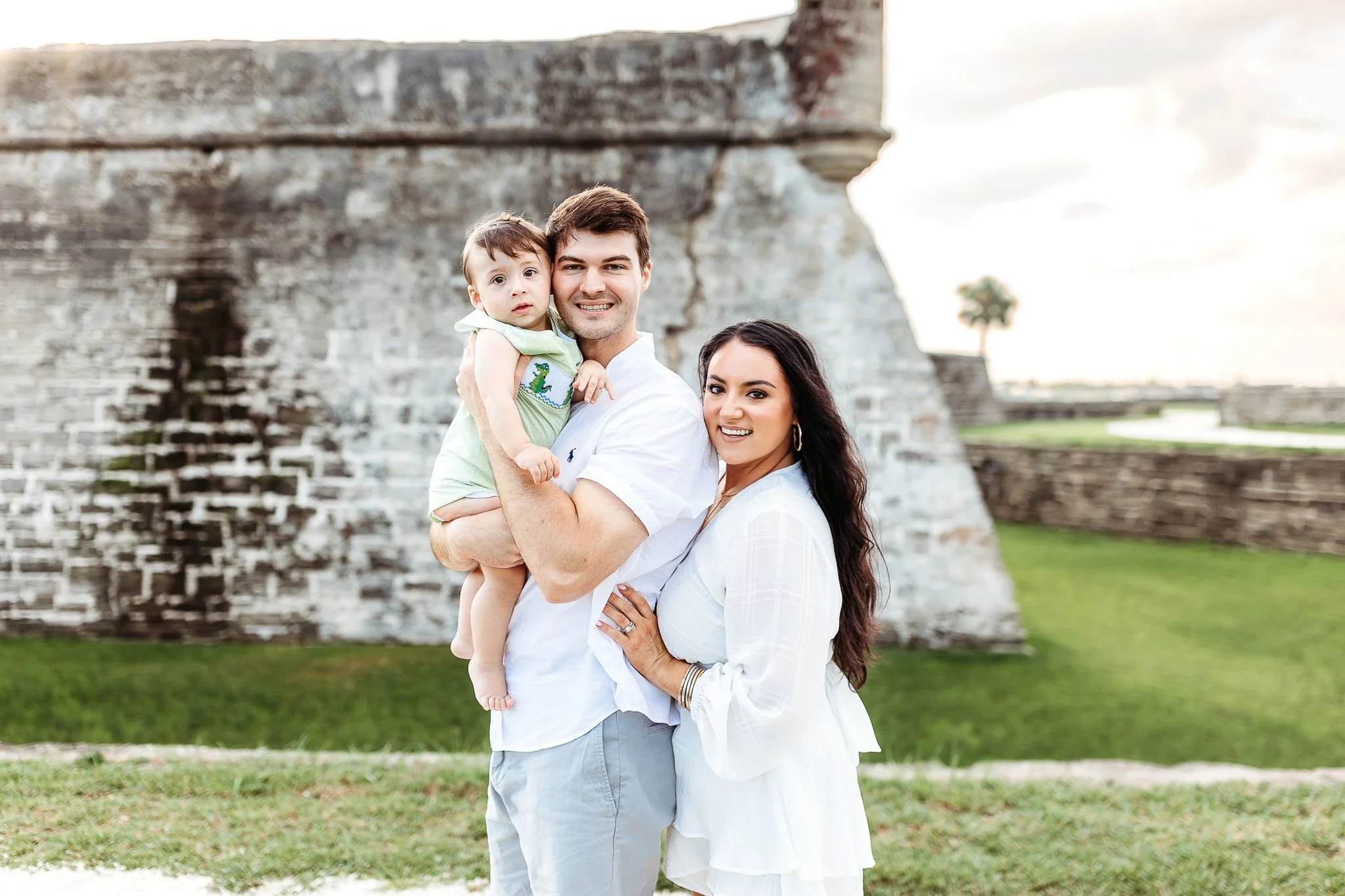 family in front of the fort in st augustine for holiday mini session photos