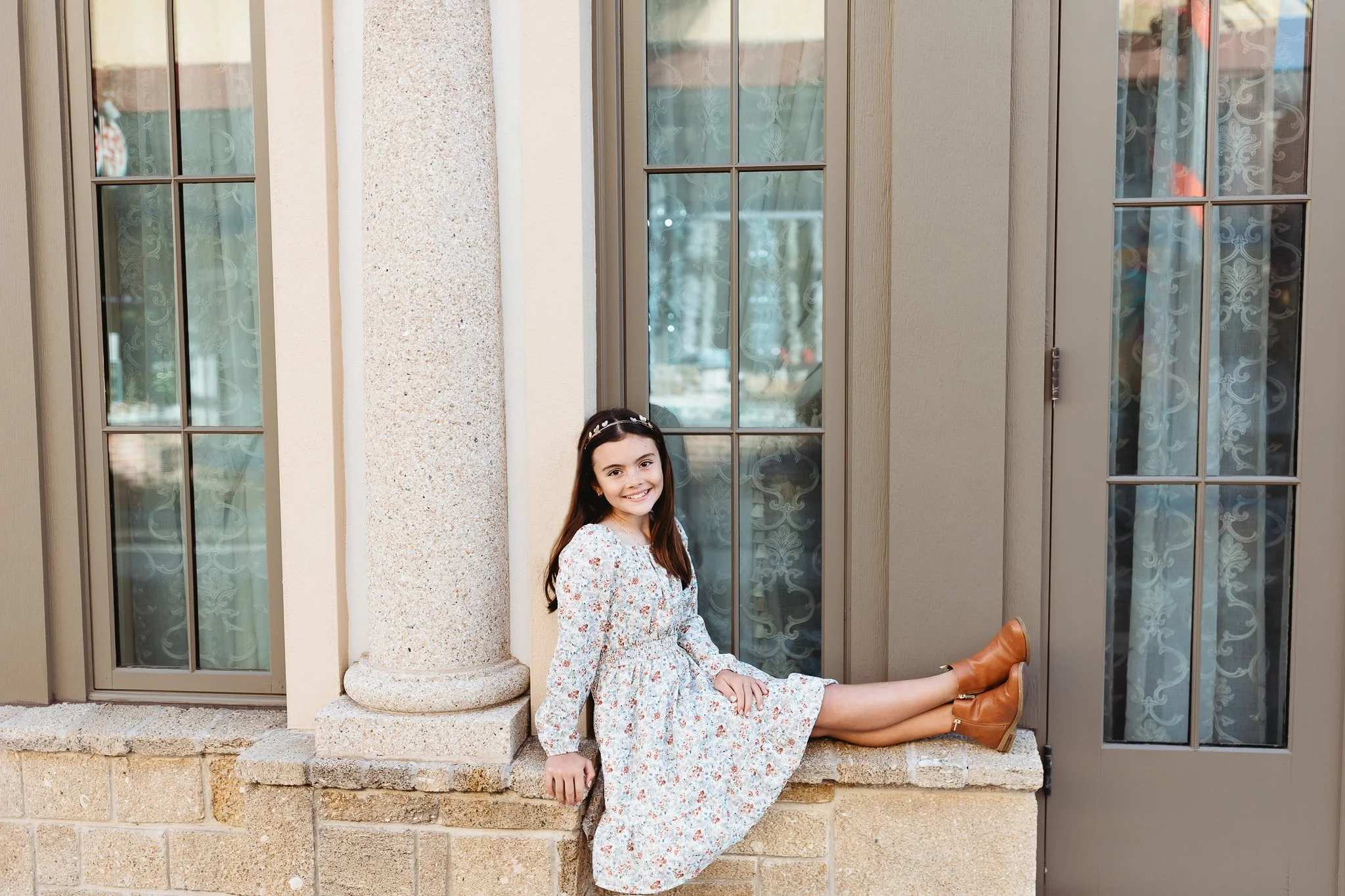 girl seated on a ledge in st augustine for portrait