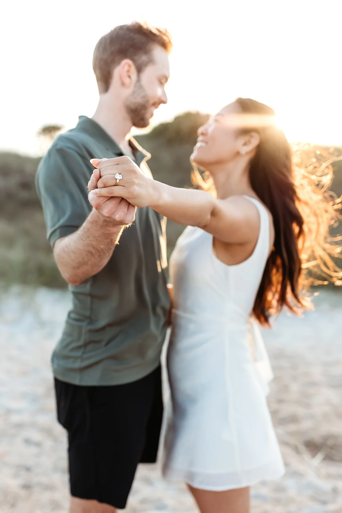 Close-up of engagement ring during beach engagement session in St. Augustine