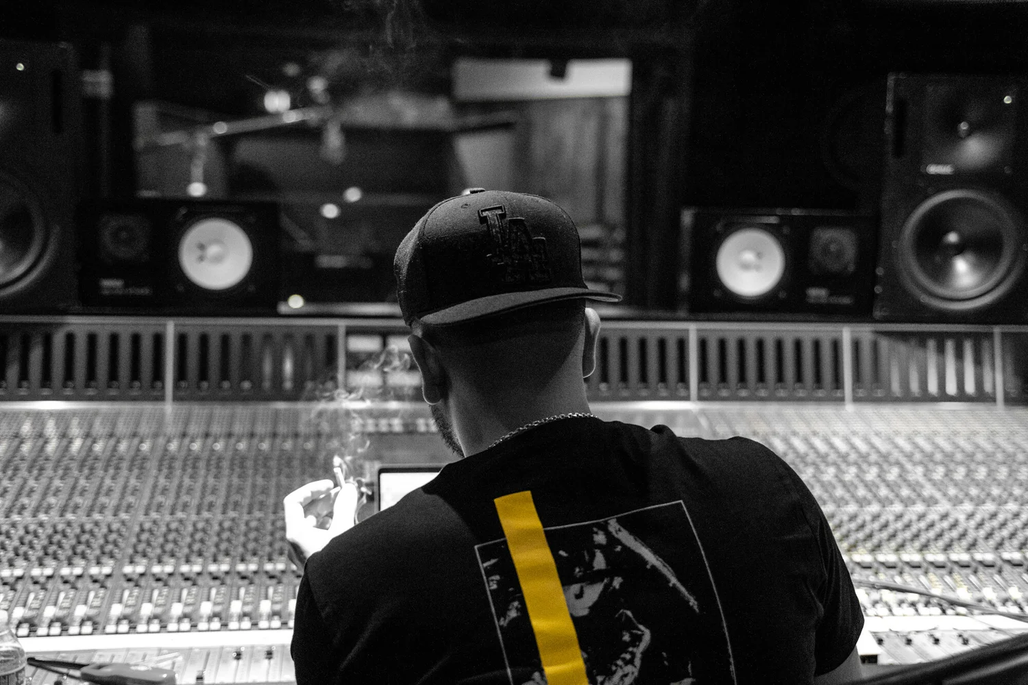 Dro mixing a record at a studio console