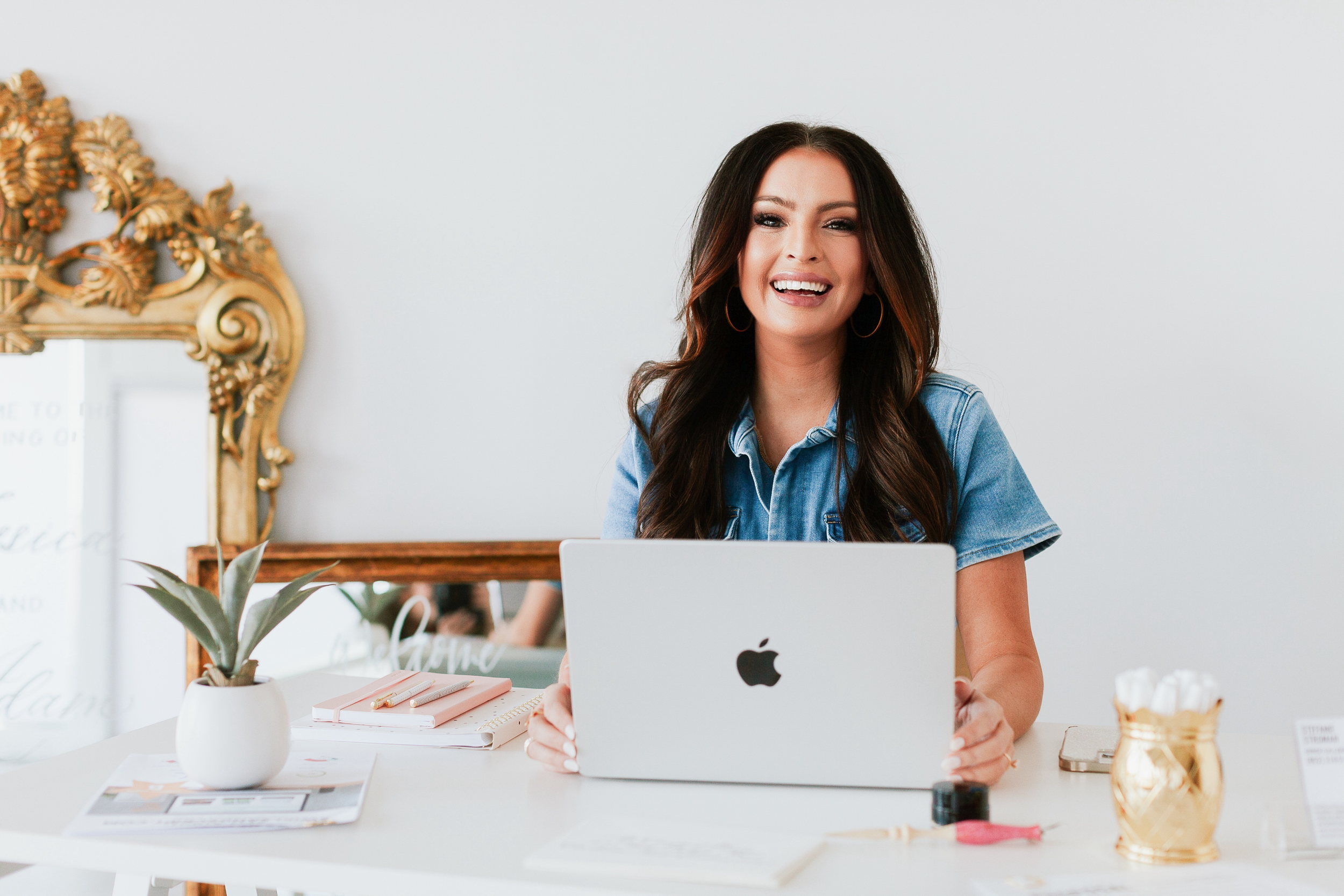 Calligrapher and Engraver Headshot in front of Apple Computer