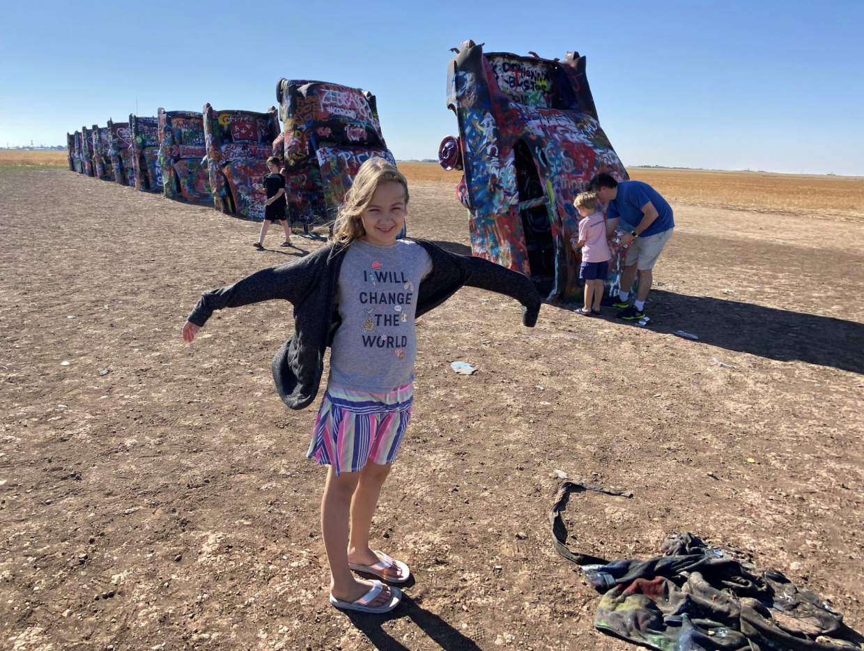 Bunny posing while Popcorn and Jude add to the art exhibit, Cadillac Ranch, photo by Karen Boudreaux, 6/8/20