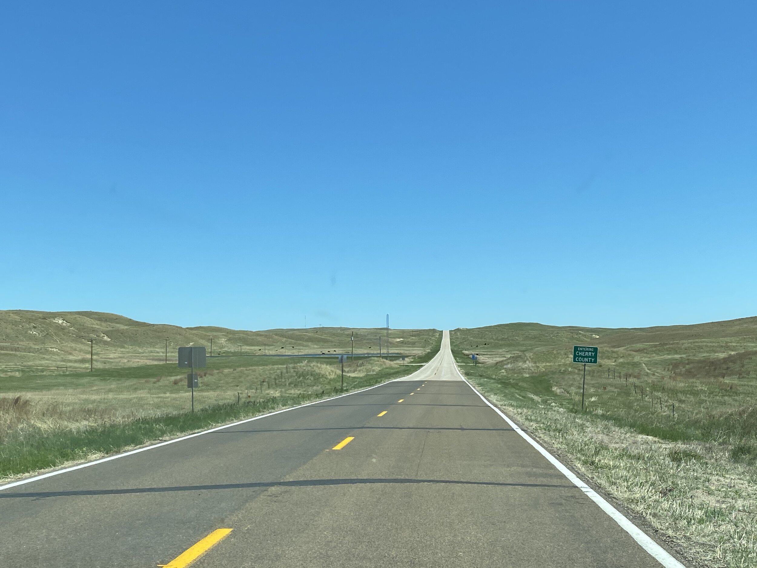 Entering beautiful, vast, and desolate Cherry County, Nebraska.  Photo by Karen Boudreaux, 5/25/21
