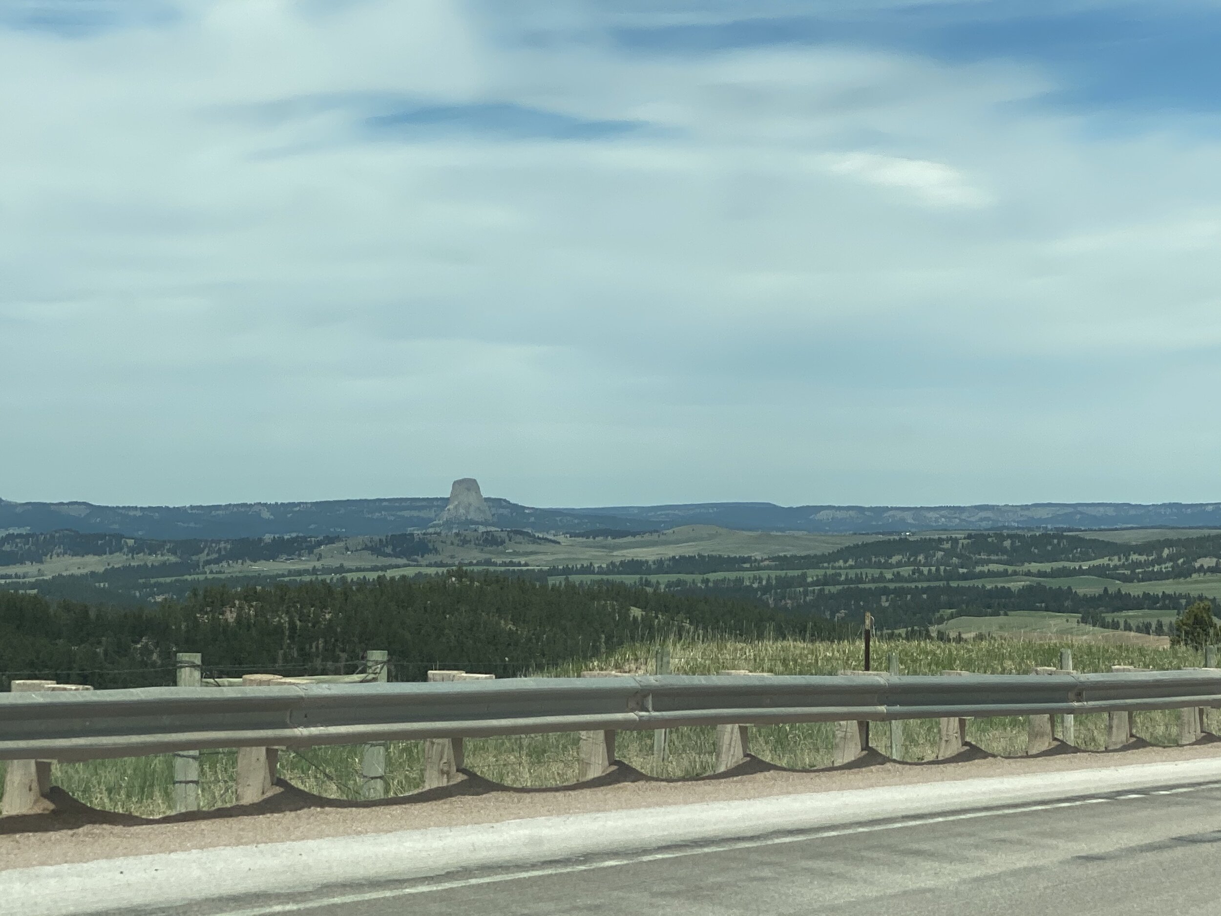 You start to see Devil’s Tower from quite a ways away.  This was at least a half-hour before we got there.  Photo by Karen Boudreaux, May 28, 2021